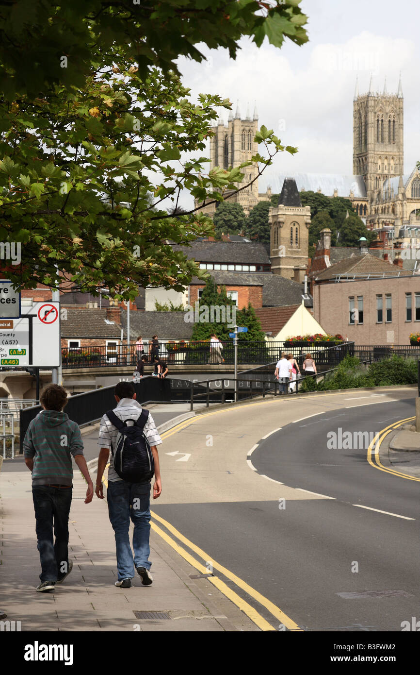 Students walking on a street in Lincoln, England, U.K. Stock Photo