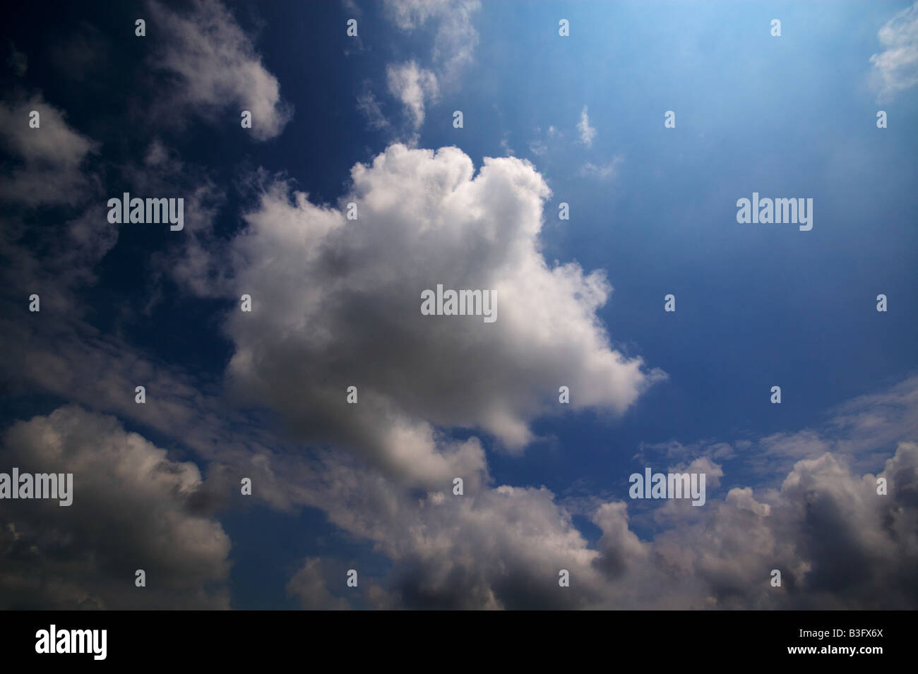 Bright blue summer sky with large fluffy clouds Stock Photo - Alamy