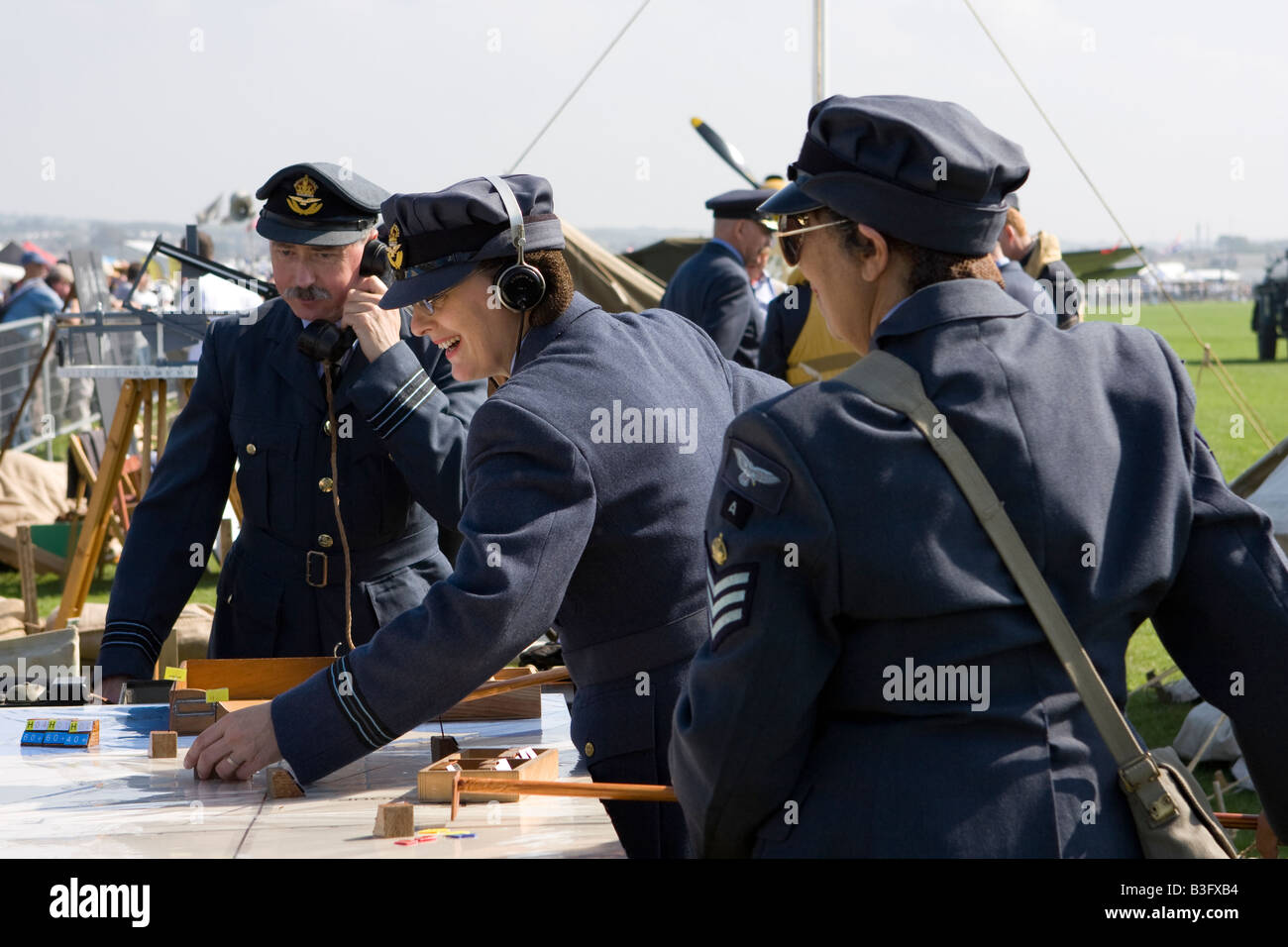 Actors in RAF uniform plotting position of aircraft during second world war re enactment Stock Photo