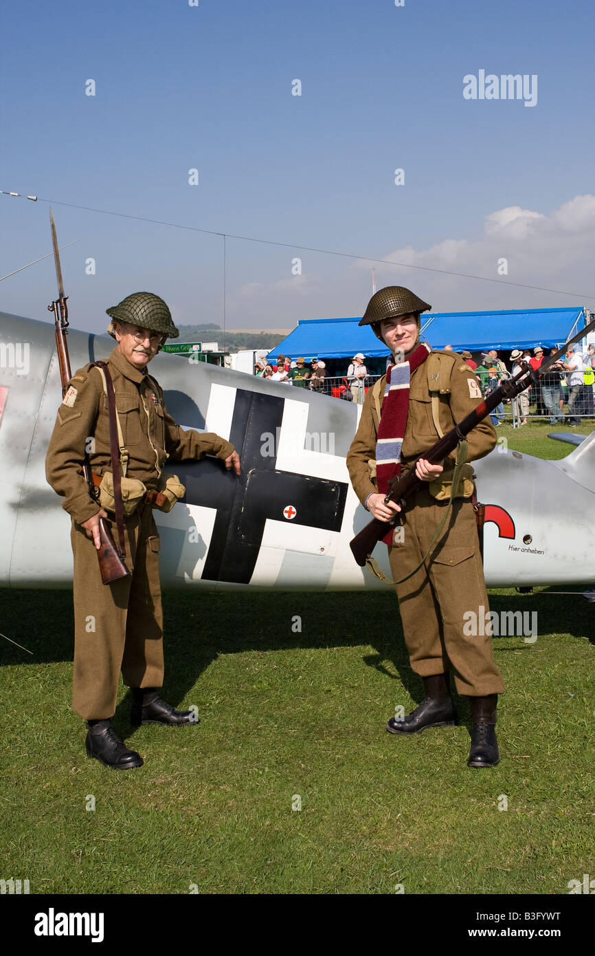 Two Dad s Army lookalike actors pose in front of Messerschmidt at RAFA Charity Airshow Shoreham Airshow Sussex England Stock Photo