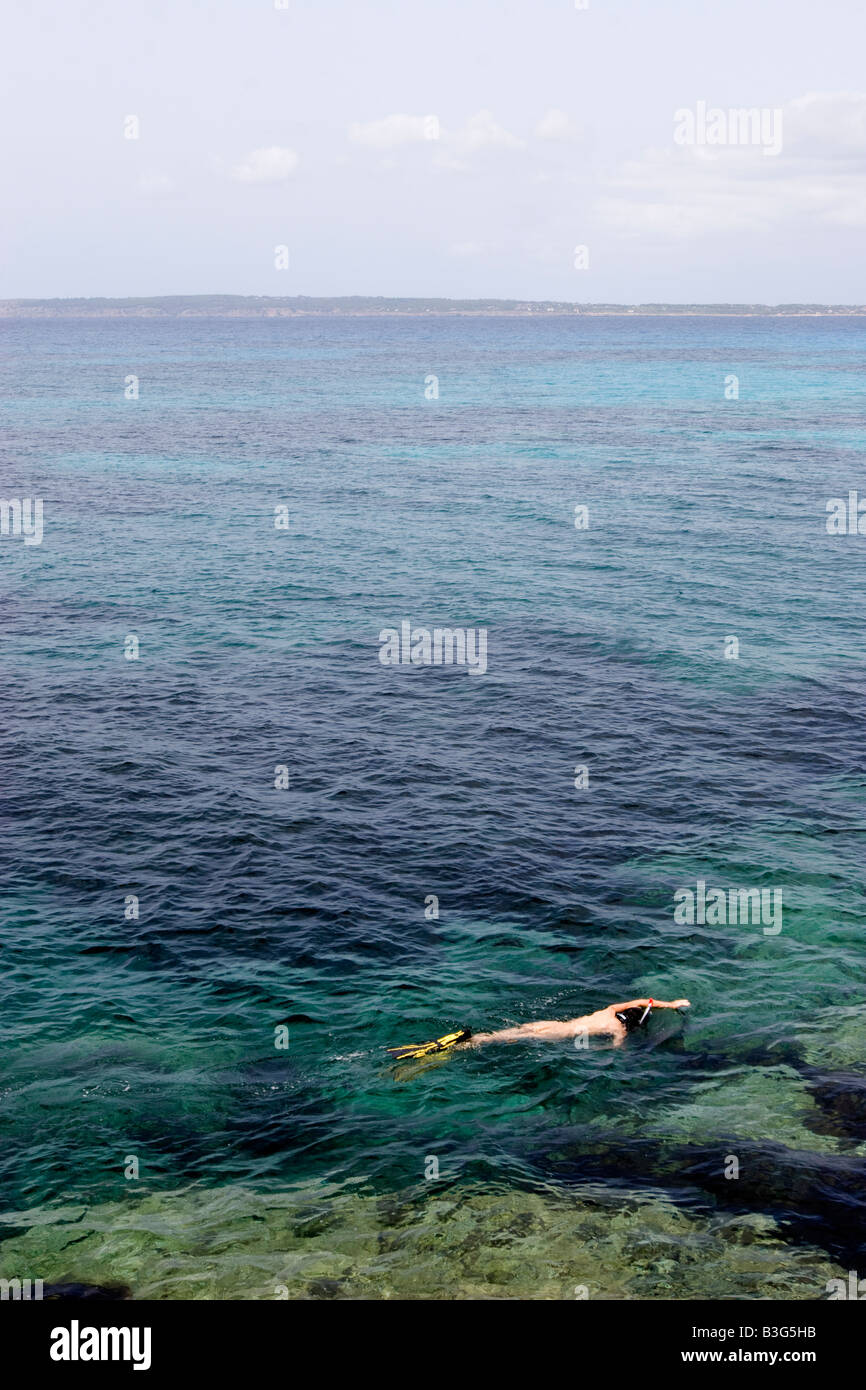 Snorkeler swiming in Formentera Stock Photo