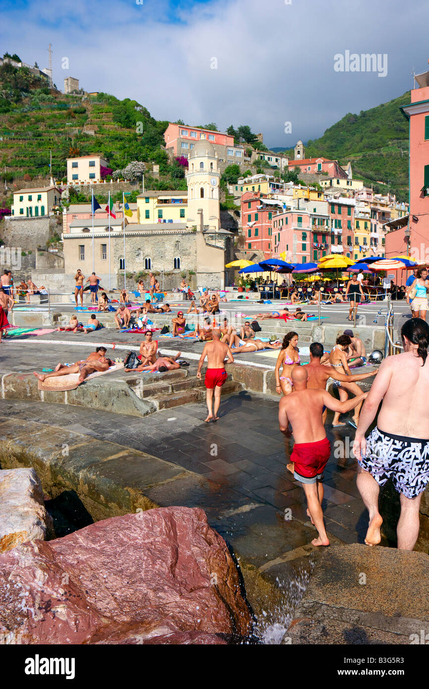 People sunbathing and enjoying the summer in Vernazza, Liturgia, Italy Stock Photo