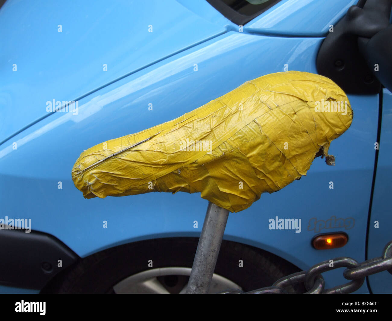 bike saddle covered with yellow adhesive tape Stock Photo Alamy
