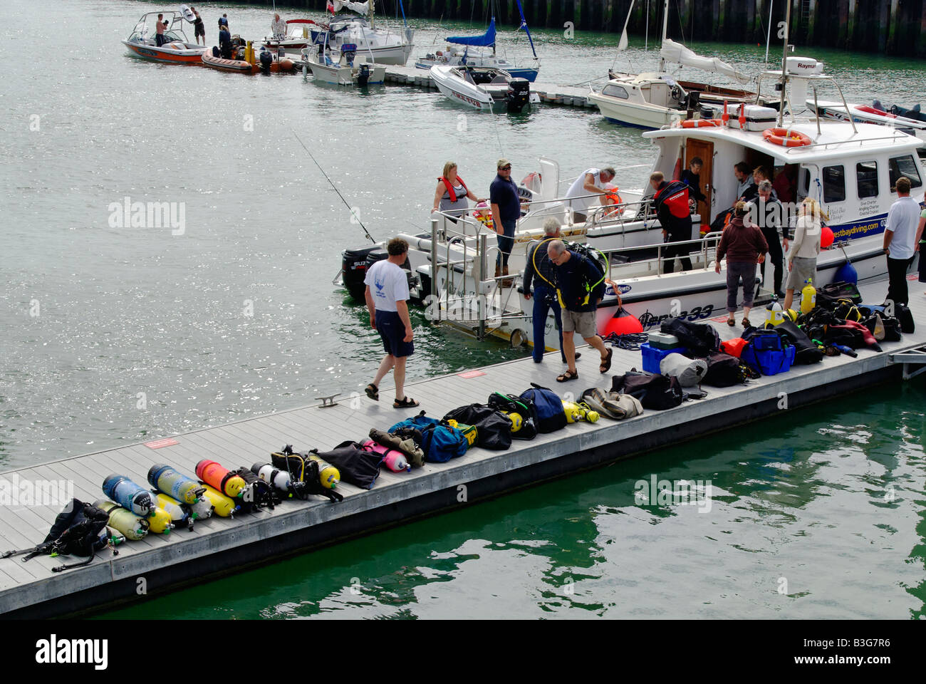 Disembarking from a scuba diving trip at West Bay Dorset Stock Photo