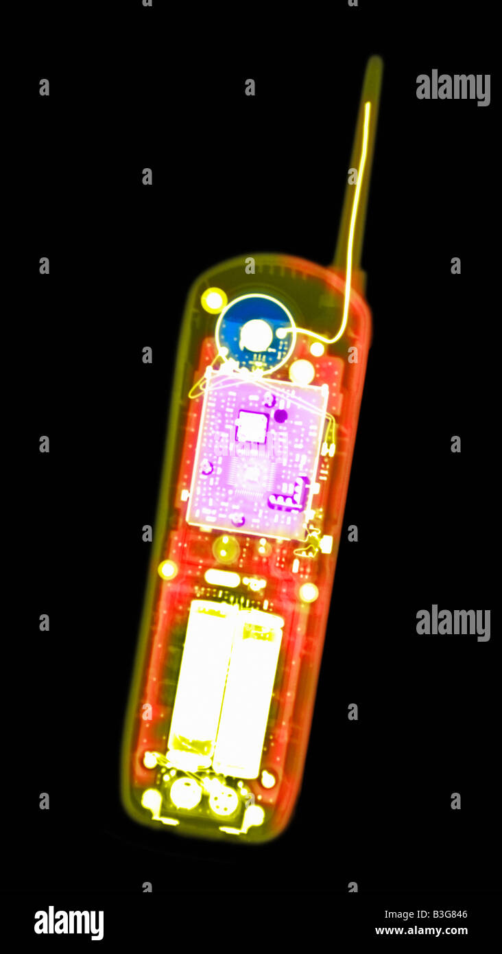 colorized x ray of a cell phone showing the internal electronic components Stock Photo