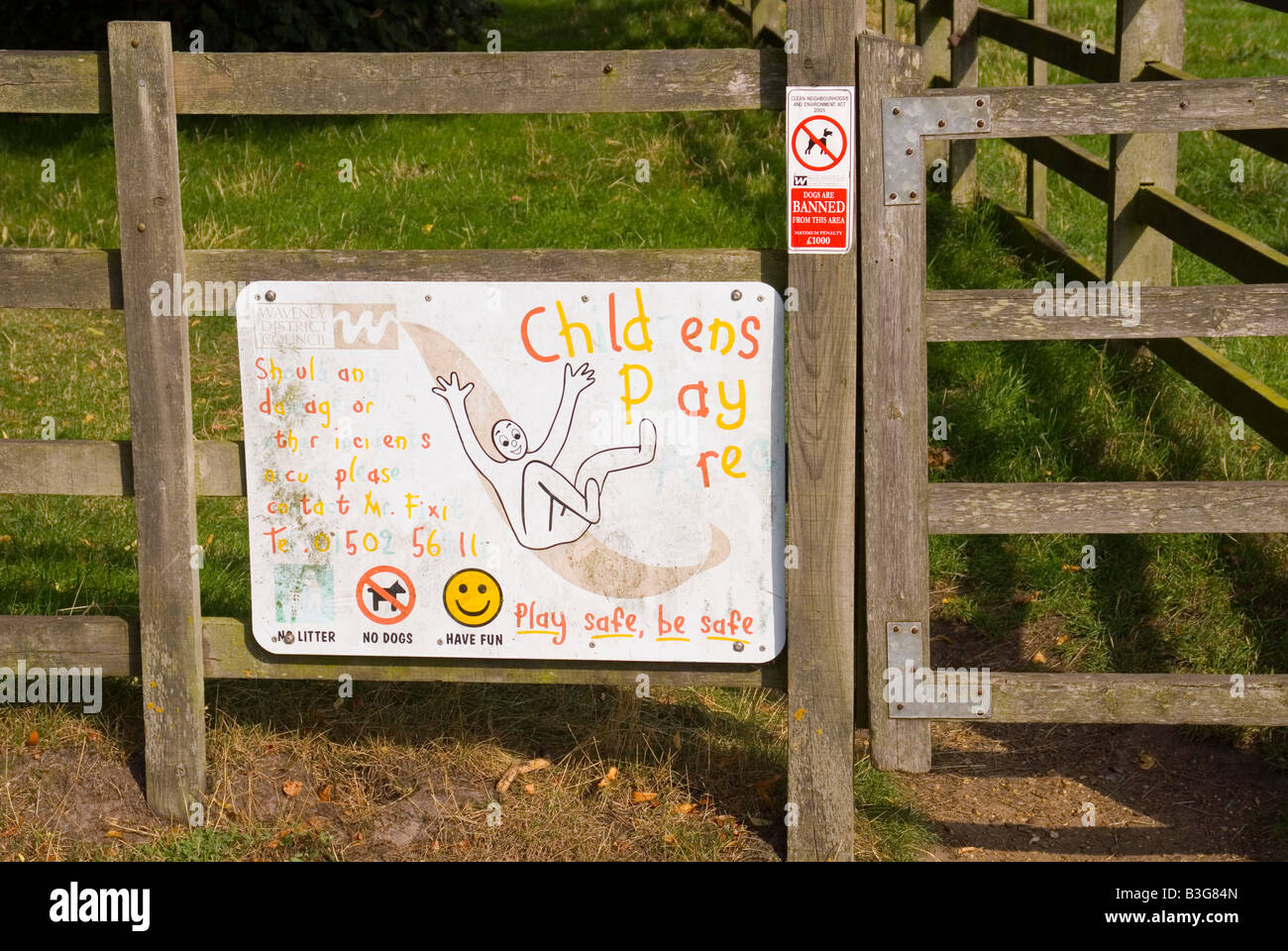 Childrens play area sign at entrance warning no dogs or litter. Stock Photo