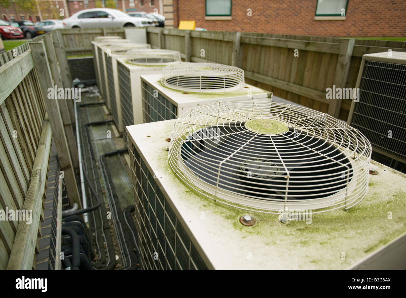 Air conditioning units outside an office block Salford Manchester UK Stock Photo