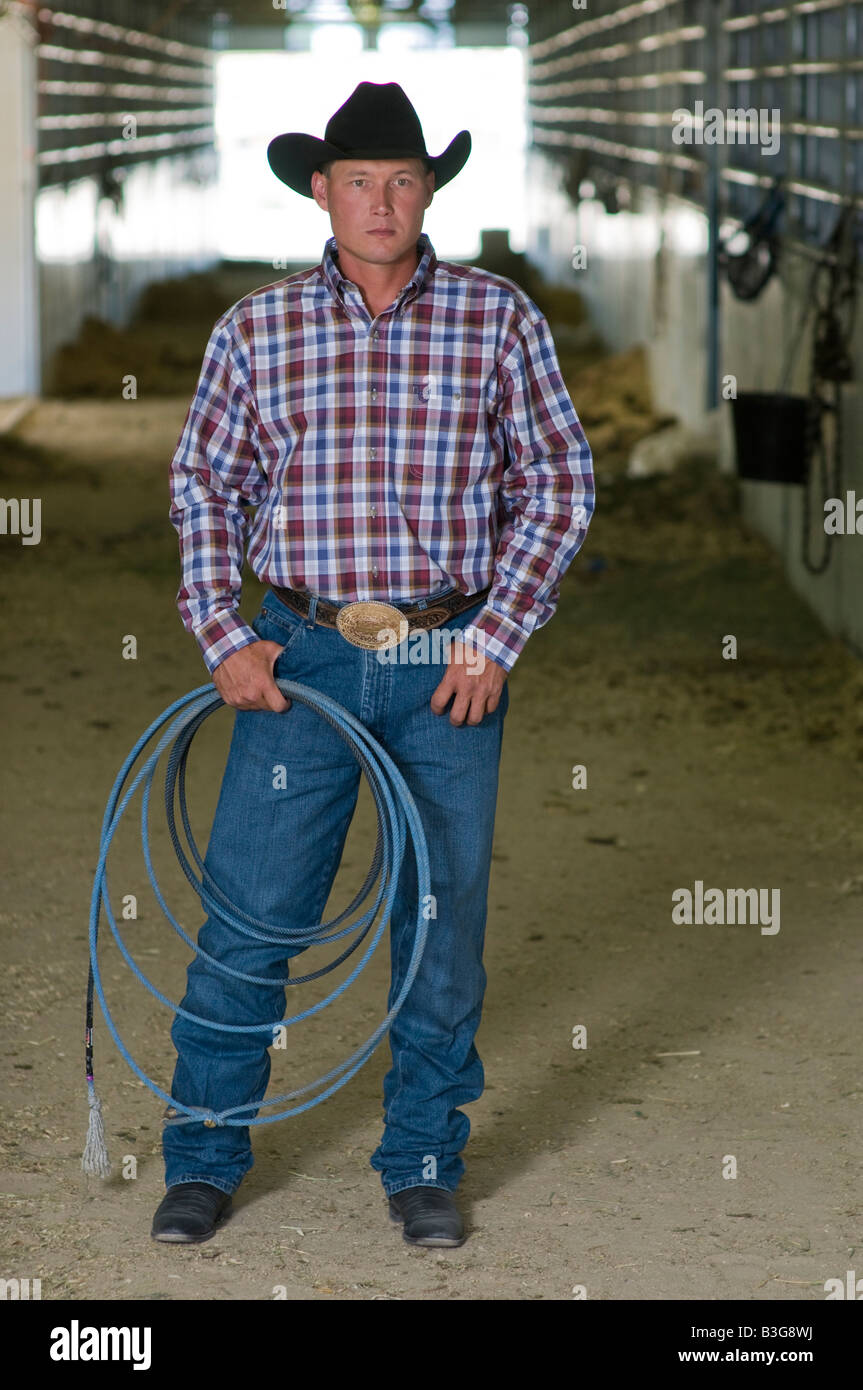 Idaho. A cowboy stands in a corral at a rodeo with his rope Stock Photo ...