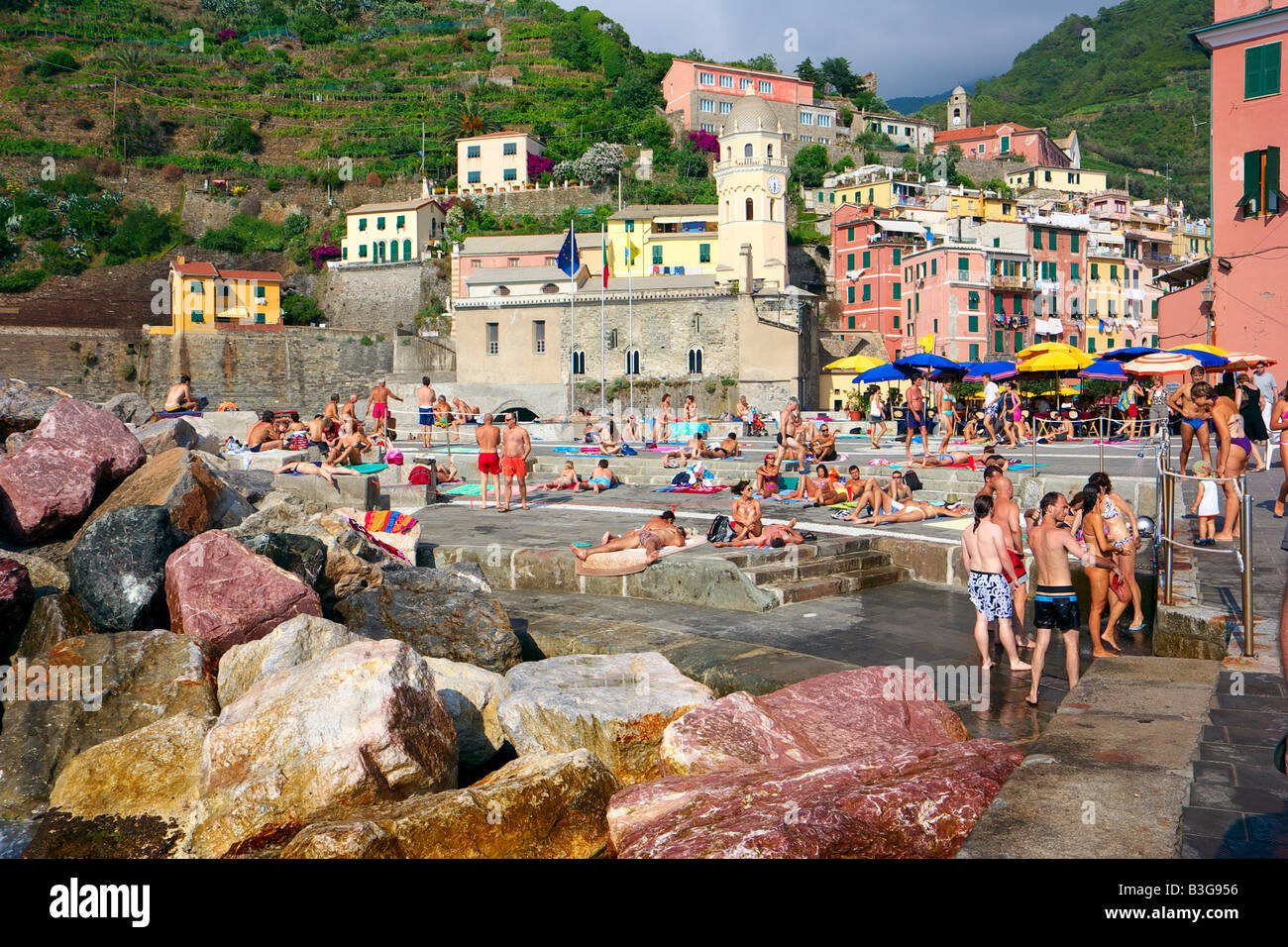 People sunbathing and enjoying the summer in Vernazza, Liturgia, Italy Stock Photo
