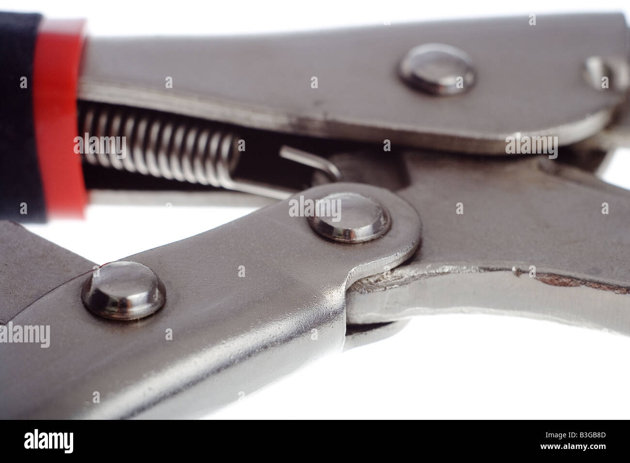 Mole wrench mechanism macro over white background Stock Photo - Alamy