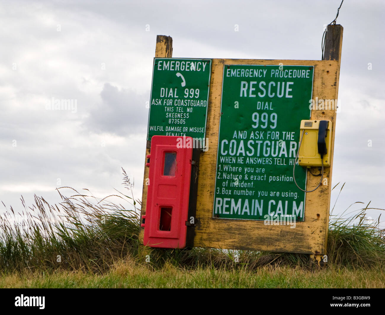 Coastguard emergency telephone and instructions notice sign on an unpatrolled beach in Lincolnshire, England, UK Stock Photo
