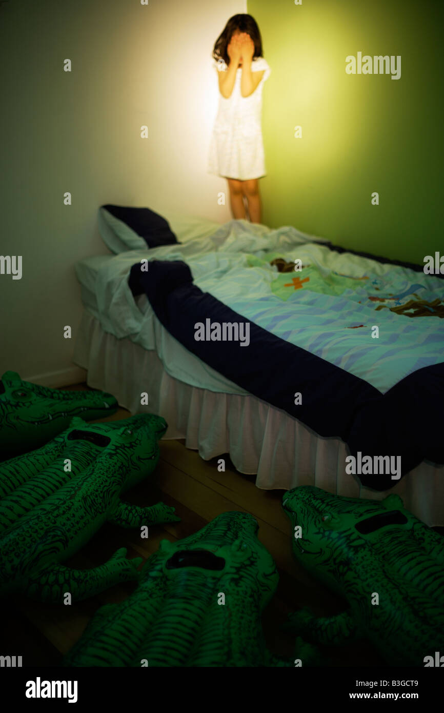 Inflatable crocodile series. Lurking by a child's bed Stock Photo