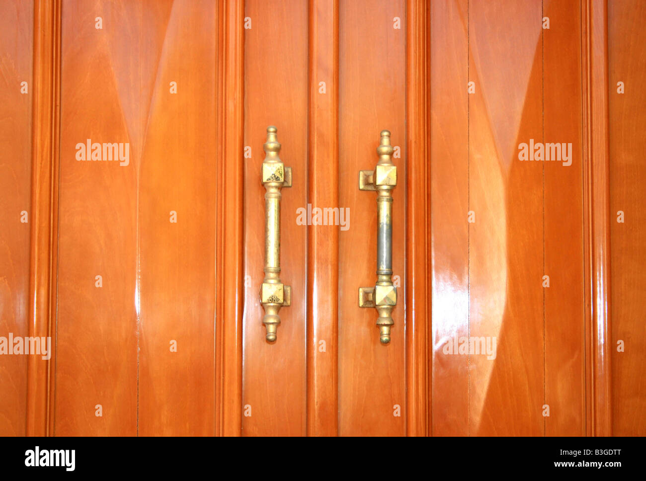 Wooden doors with metallic handles Stock Photo