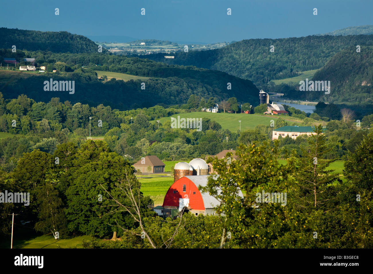 Red barn and farms in Mohawk Valley New York State in background Mohawk River passing through The Noses Stock Photo