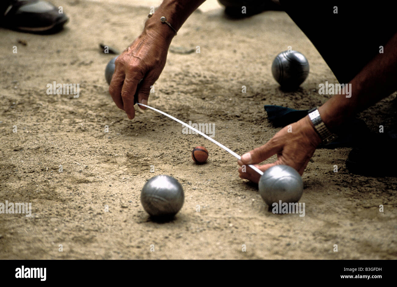 measurement during a game of boule Stock Photo - Alamy