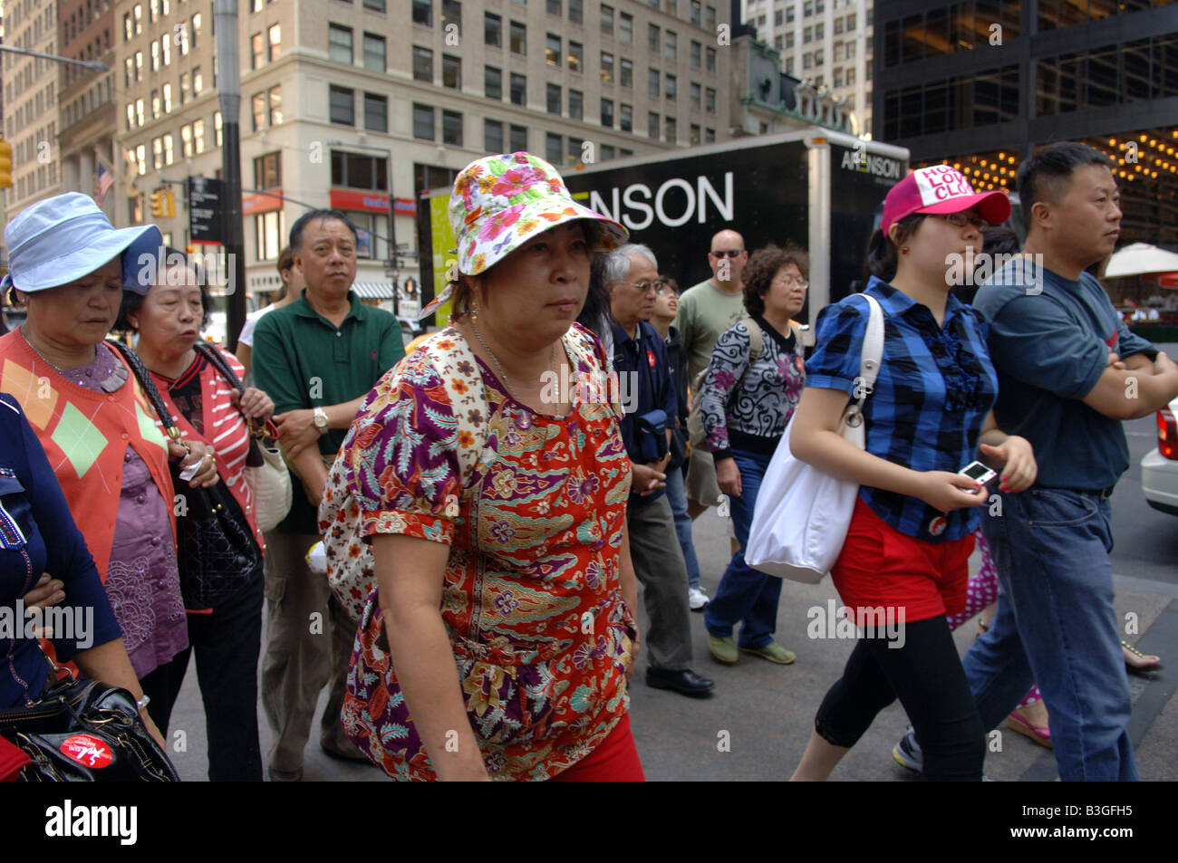 Chinese tourists stroll the streets of lower Manhattan in New York on Thursday August 21 2008 Frances M Roberts Stock Photo