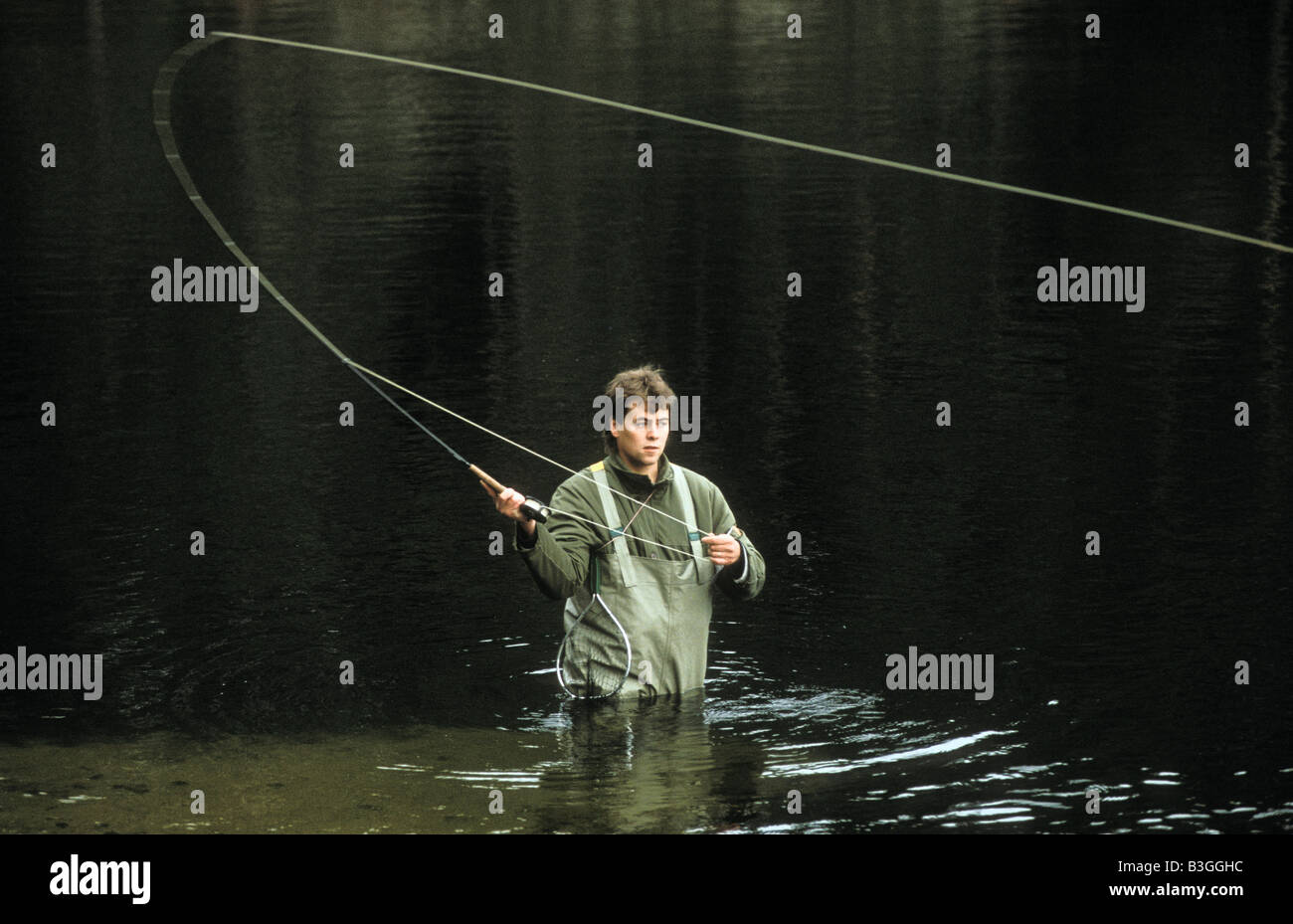 Flyfishing in a put n take lake in Hökensås in south Sweden Stock Photo