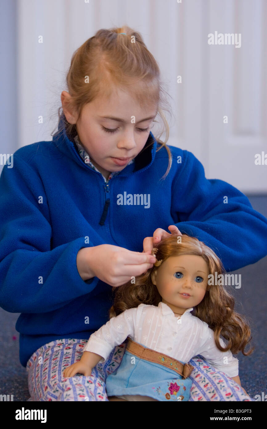 Child playing with her doll Stock Photo Alamy