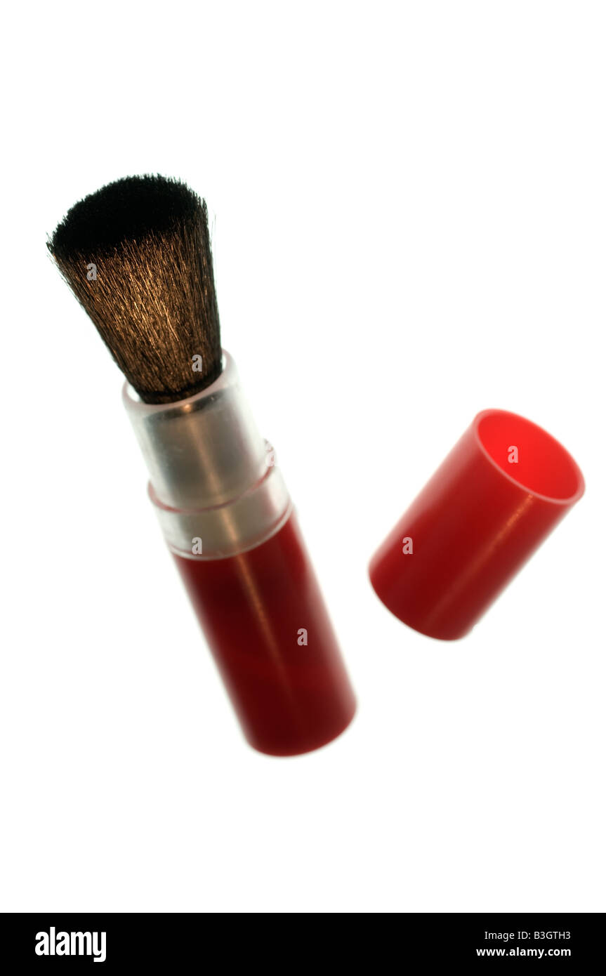 Small red camera lens dust brush and cap Stock Photo