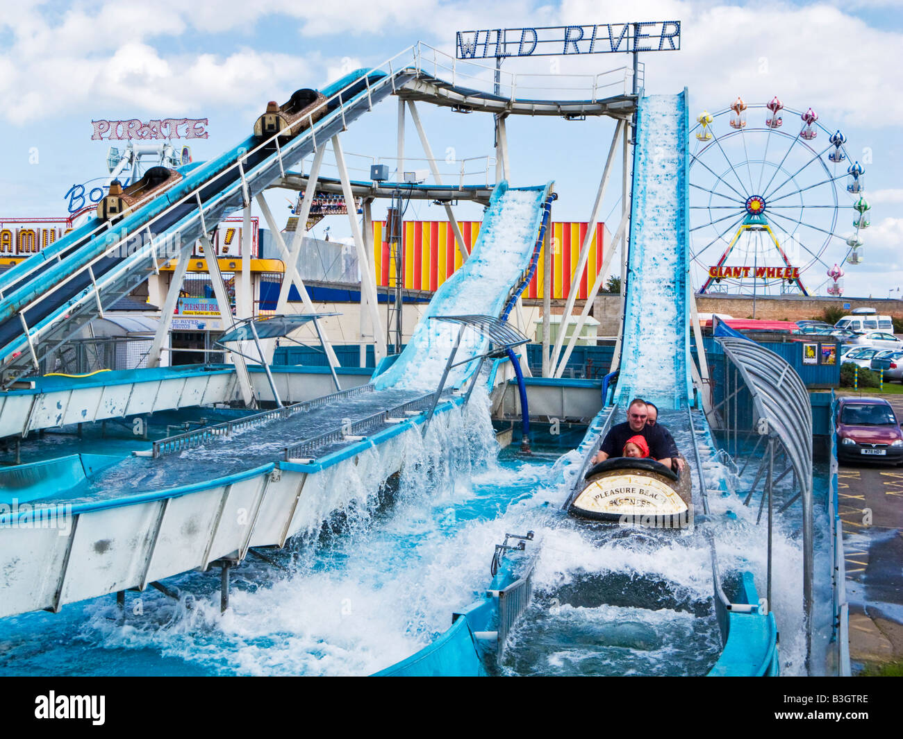 Family having fun on the Log flume at Skegness seafront fairground amusement park Lincolnshire England UK Stock Photo