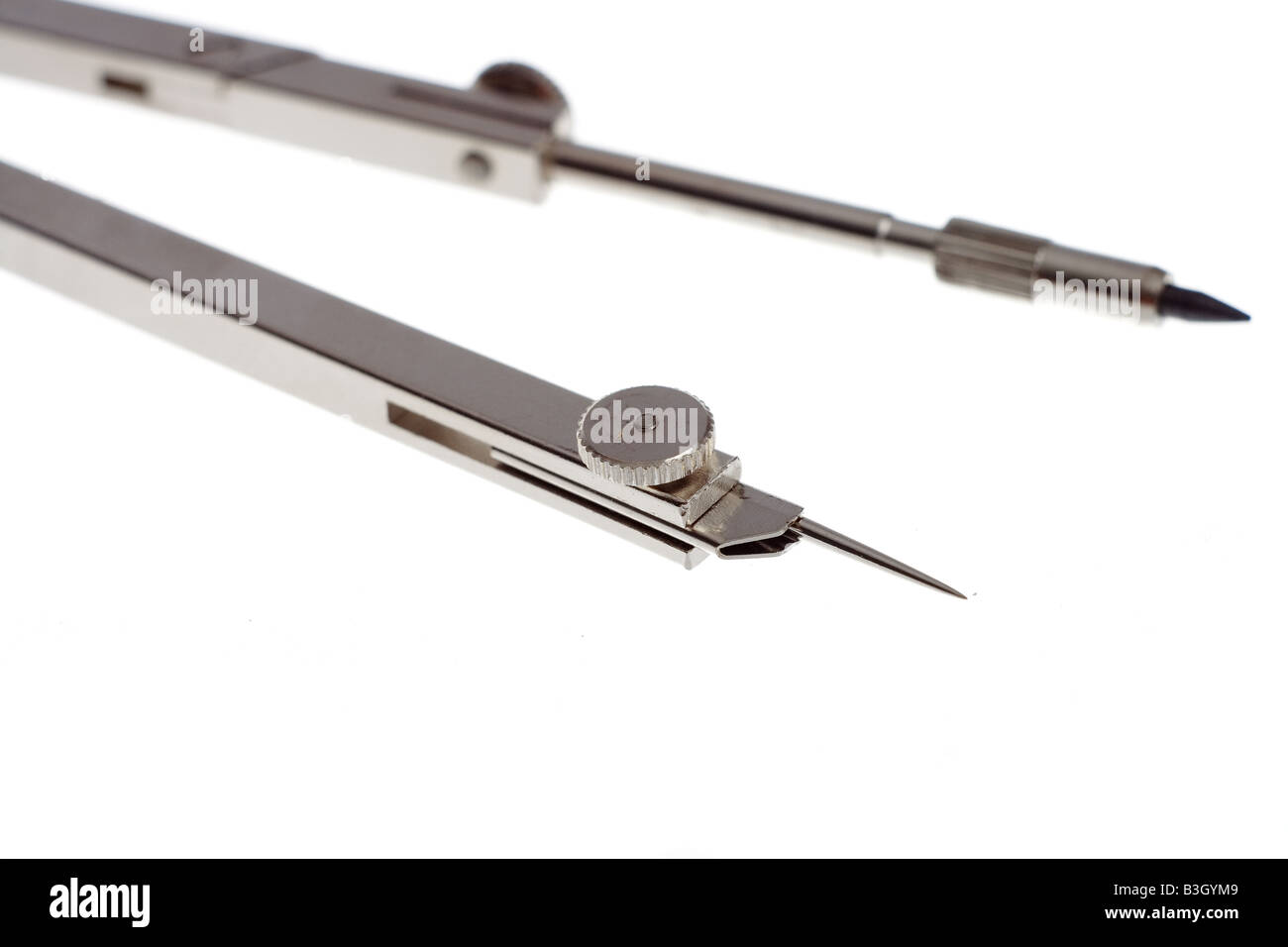 Macro of compasses over white background Stock Photo - Alamy