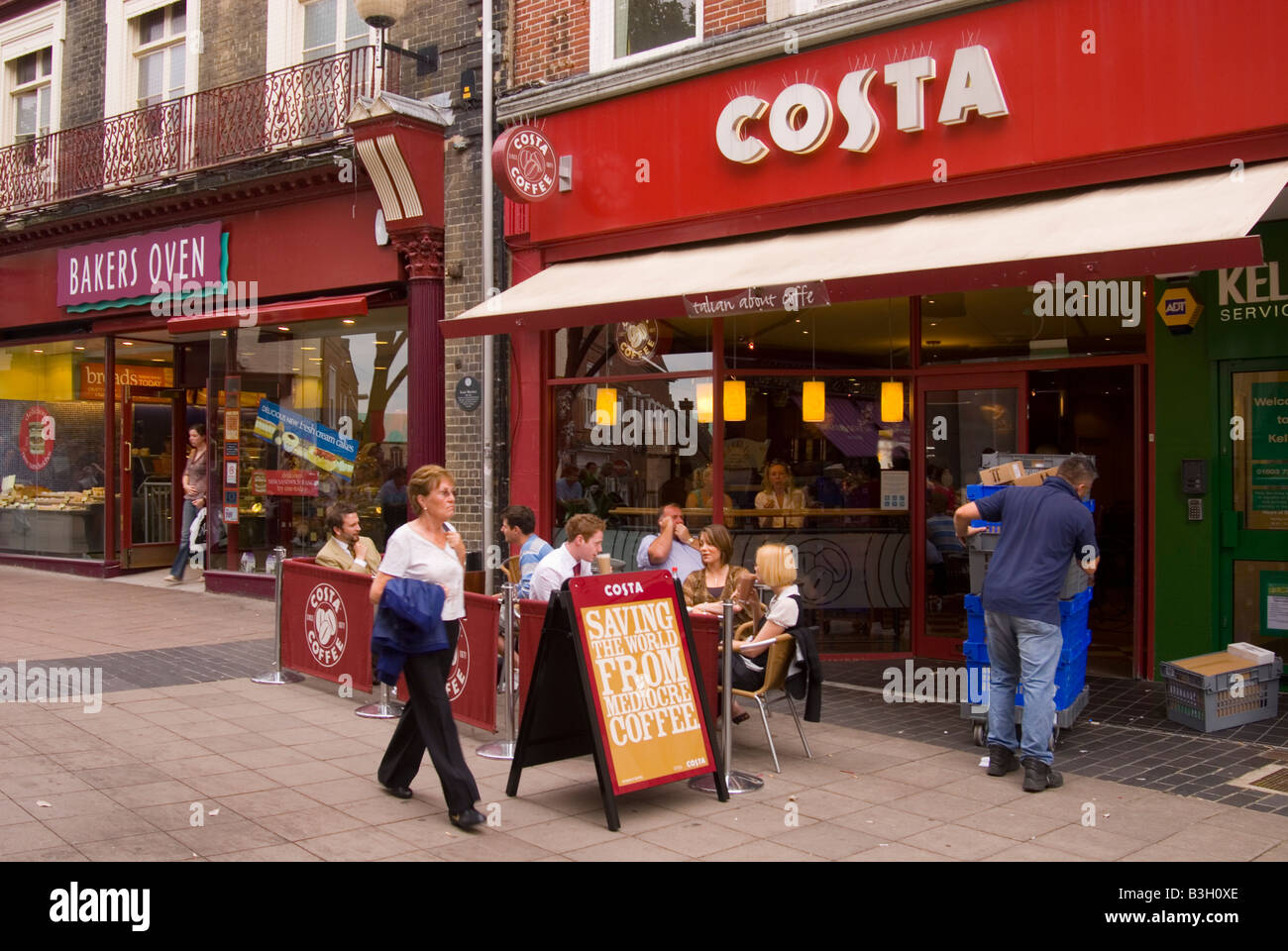 Costa Coffee shop with customers enjoying coffee outside in Norwich