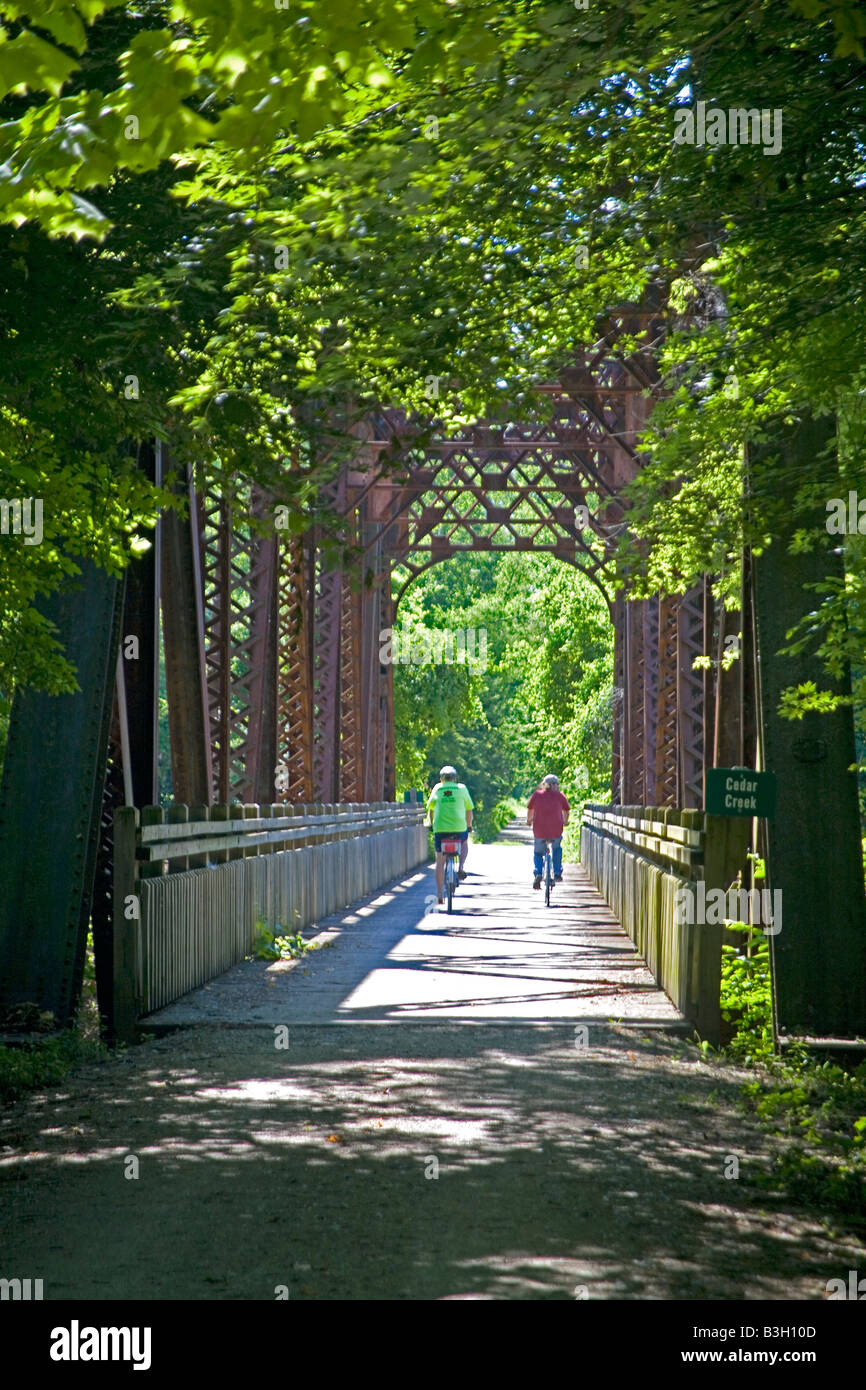 Bicyclists on bridge on KATY Trail Stock Photo