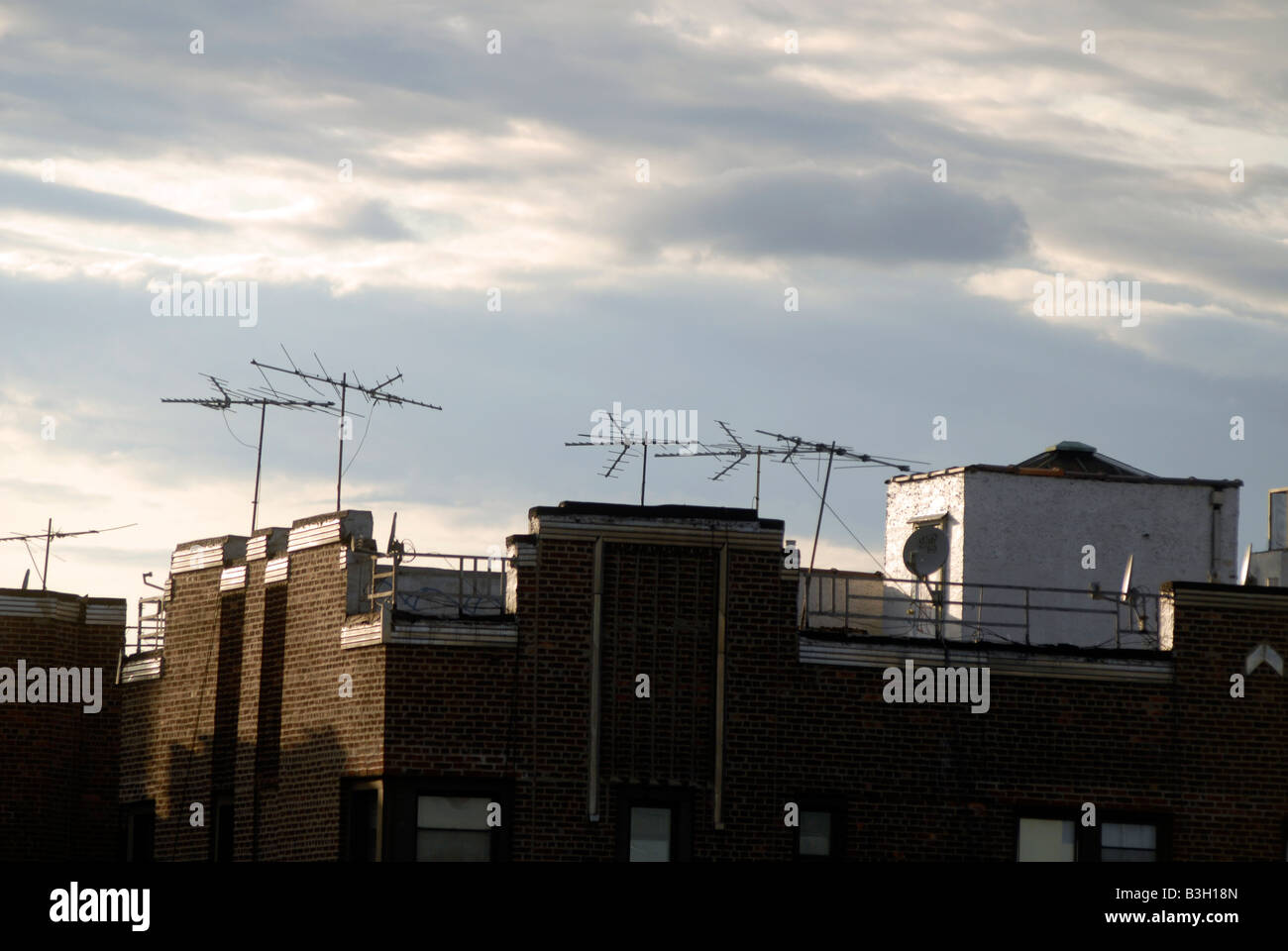 Television antennas on the roof of buildings in the borough of Queens in New York Stock Photo