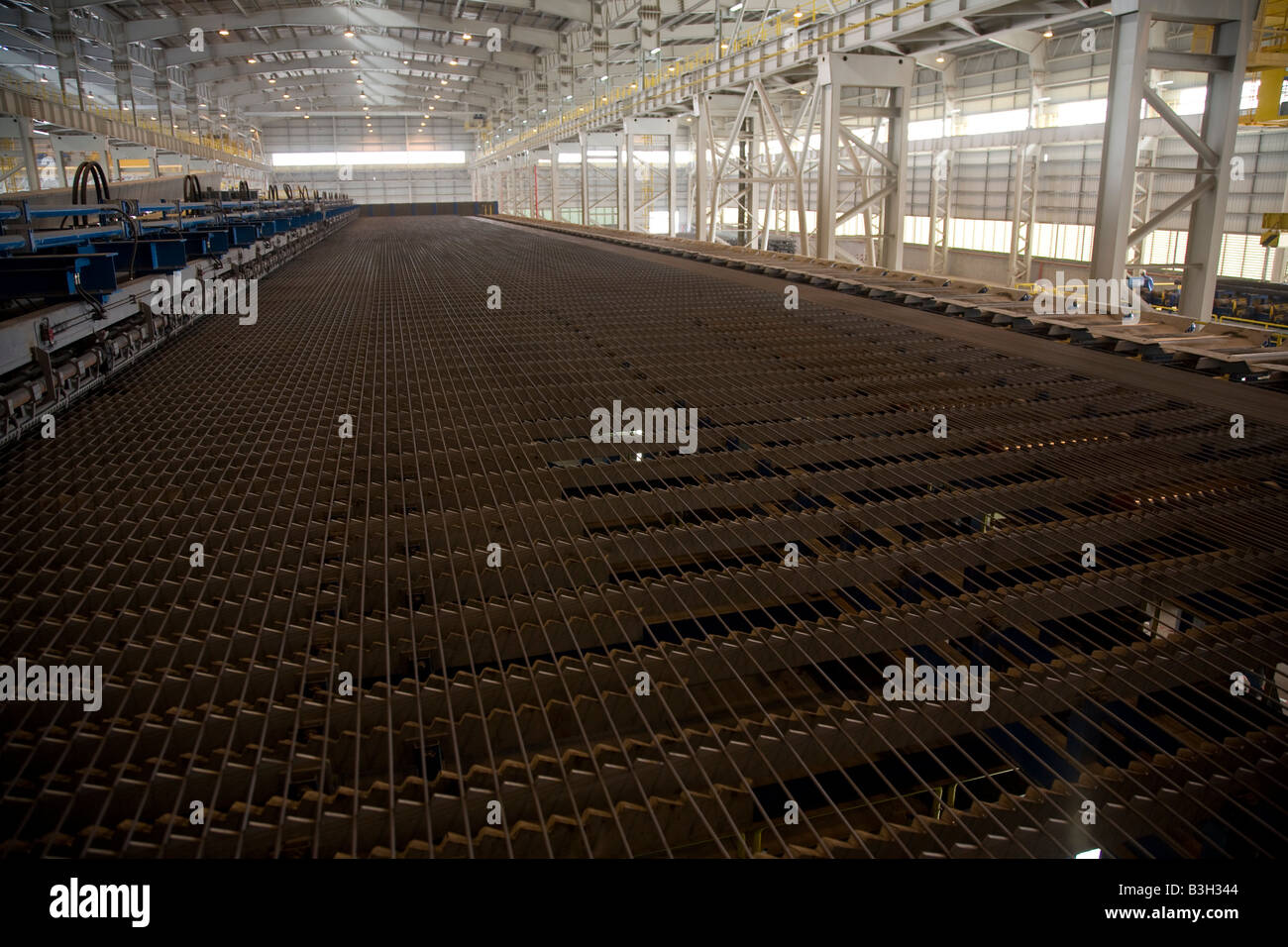 rebar steel rods on production line at EISF Steel Plant Abu Dhabi United  Arab Emirates UAE Middle East arabian gulf Stock Photo - Alamy