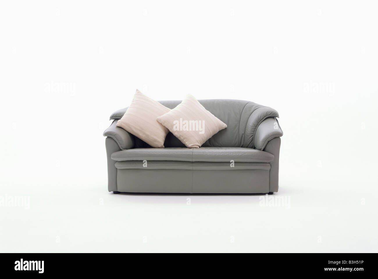 Gray sofa and cushions Stock Photo Alamy