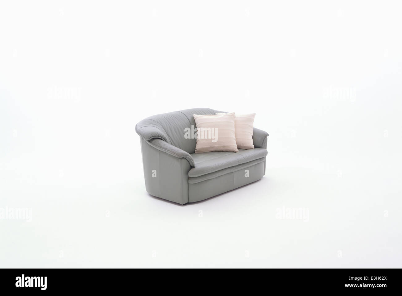 Gray sofa and cushions Stock Photo - Alamy