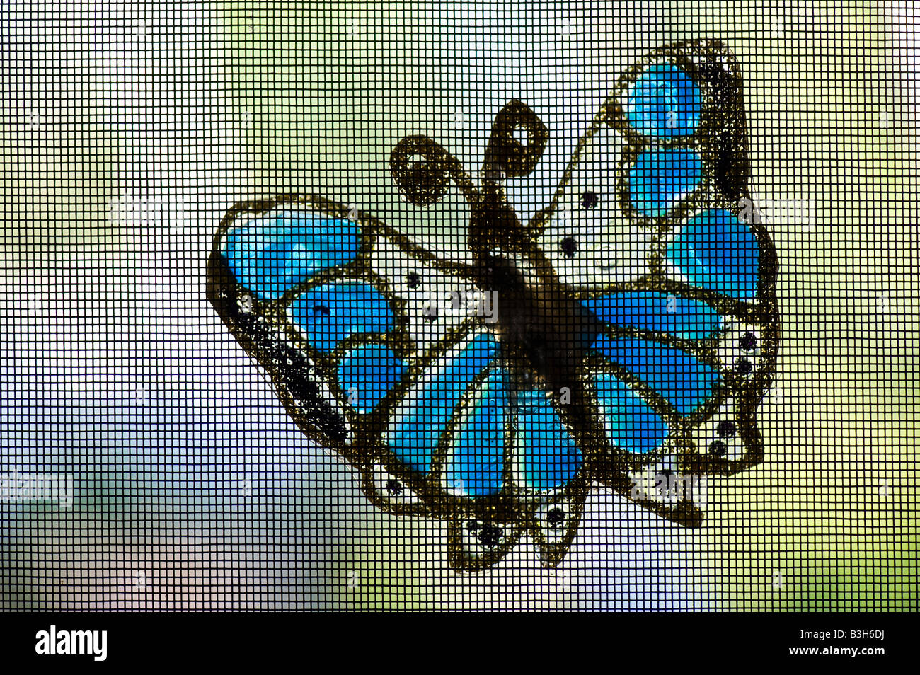 A household butterfly decoration on a screen door Stock Photo Alamy