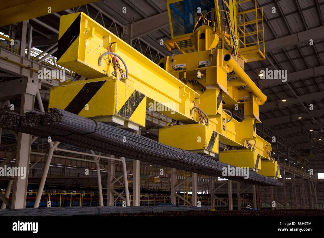 crane in steel plant lifting steel rebar rods at EISF Steel