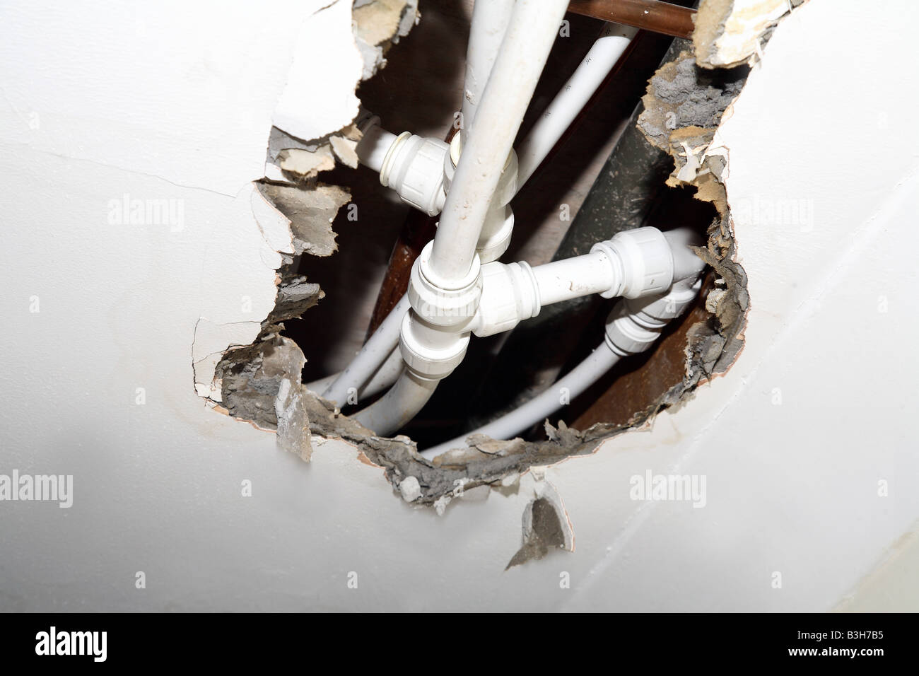 Burst pipe looking through damaged hires stock photography and images