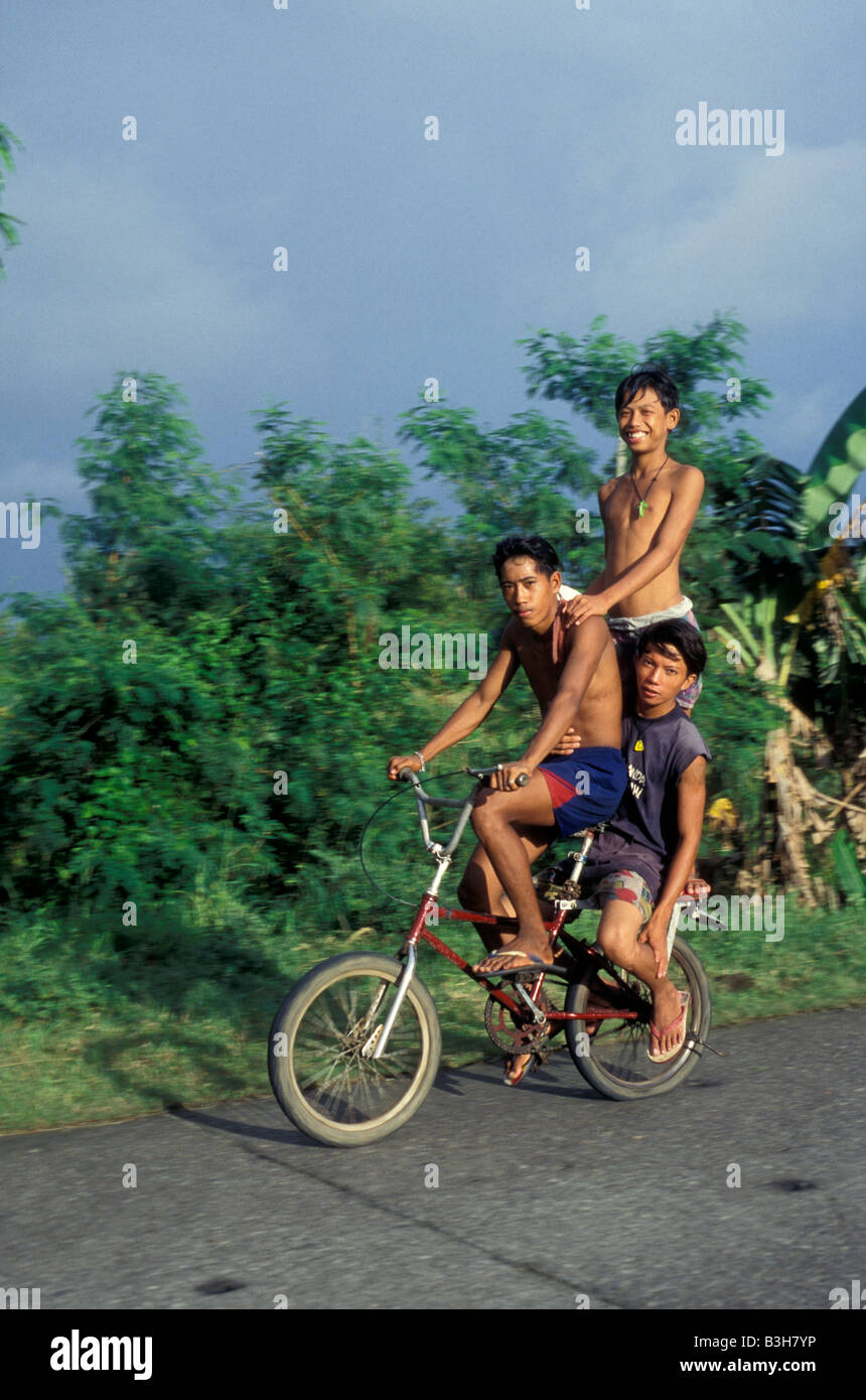 kids on bike in leyte philippines Stock Photo Alamy