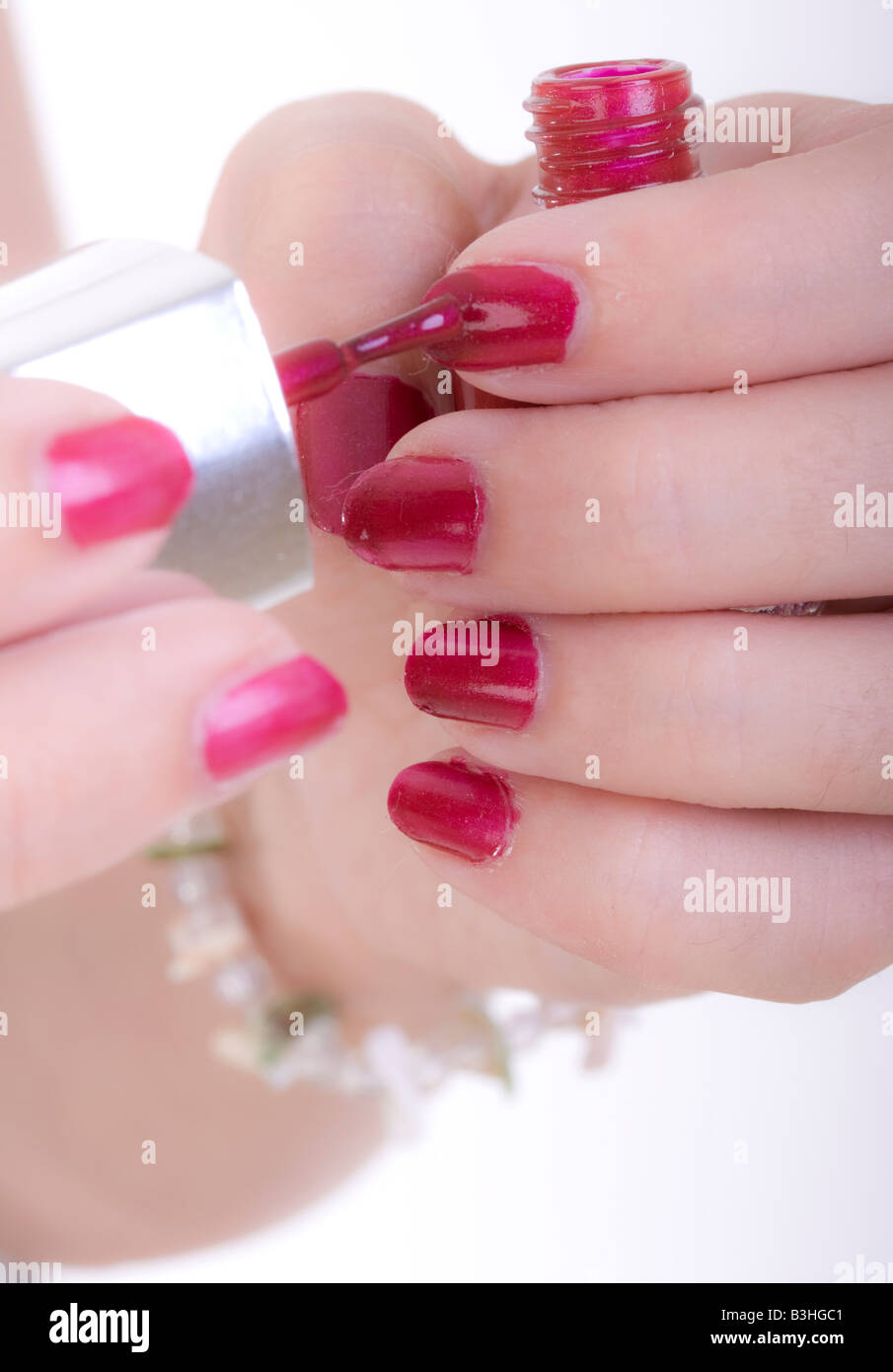 painting fingernails with nail polish Stock Photo - Alamy