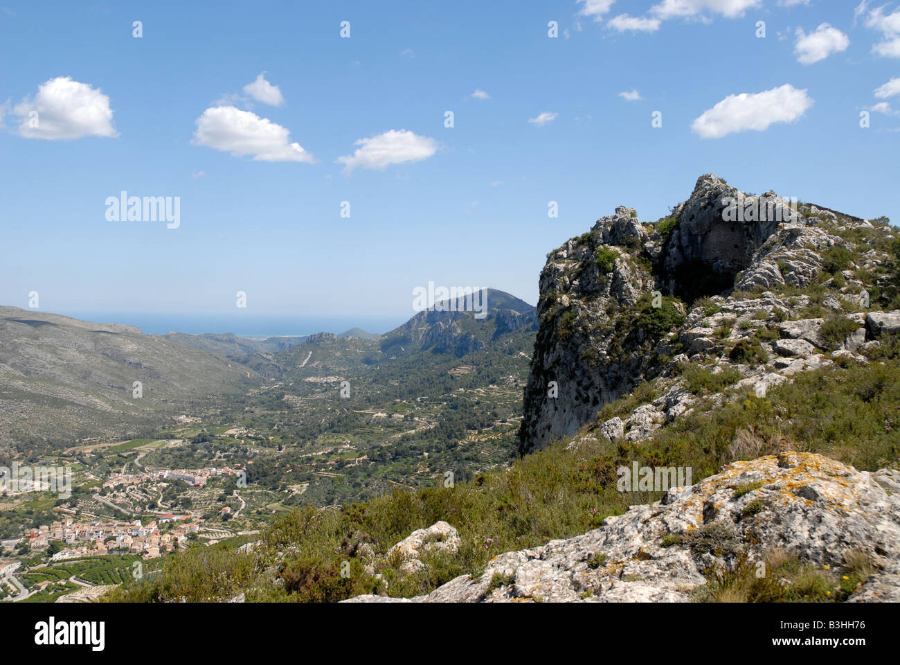 looking down Vall de Gallinera to Benitaia & coast from Sierra de la Forada, Alicante Province, Comunidad Valenciana, Spain Stock Photo
