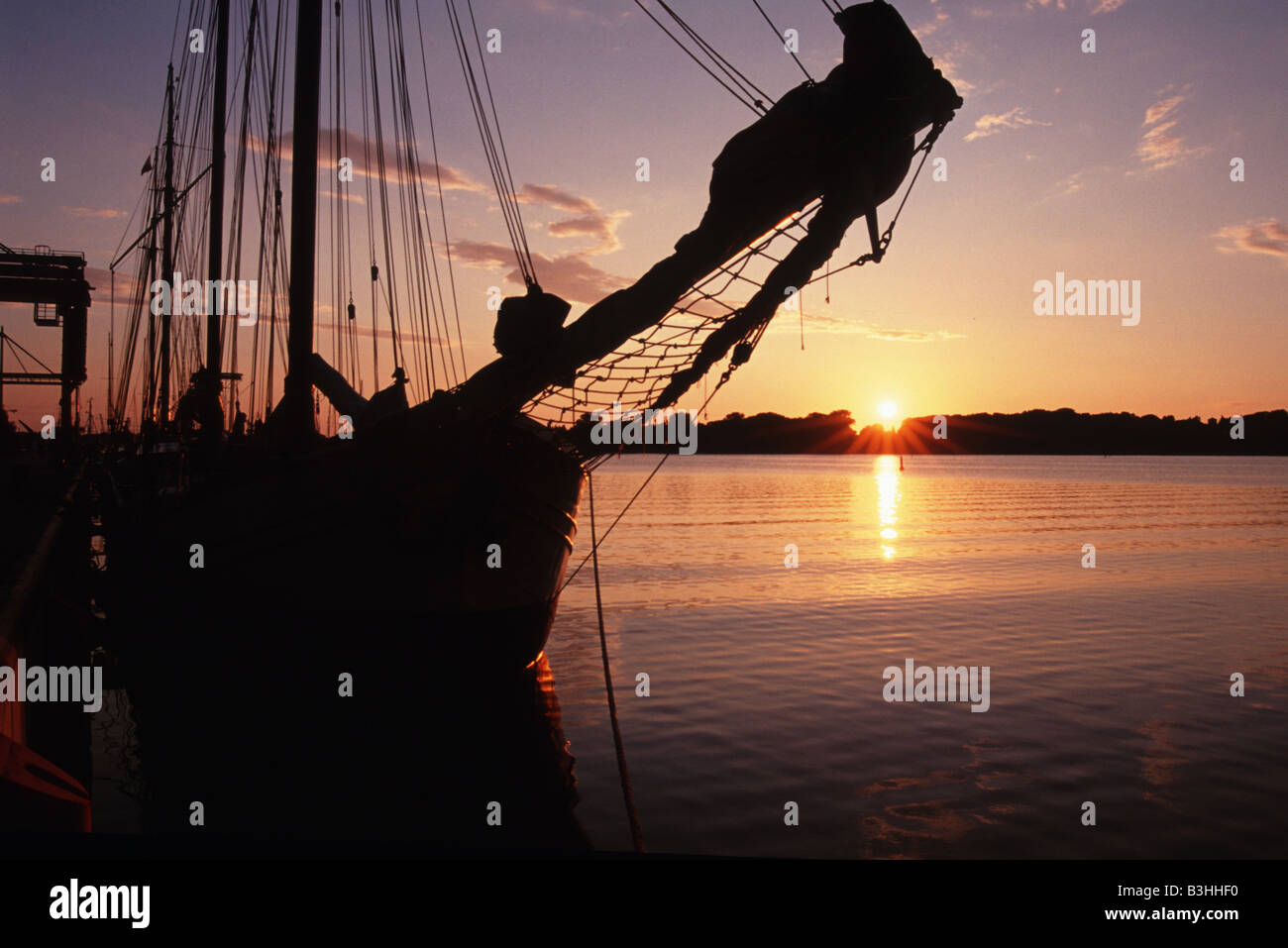 Sailing ship and sundown Stock Photo