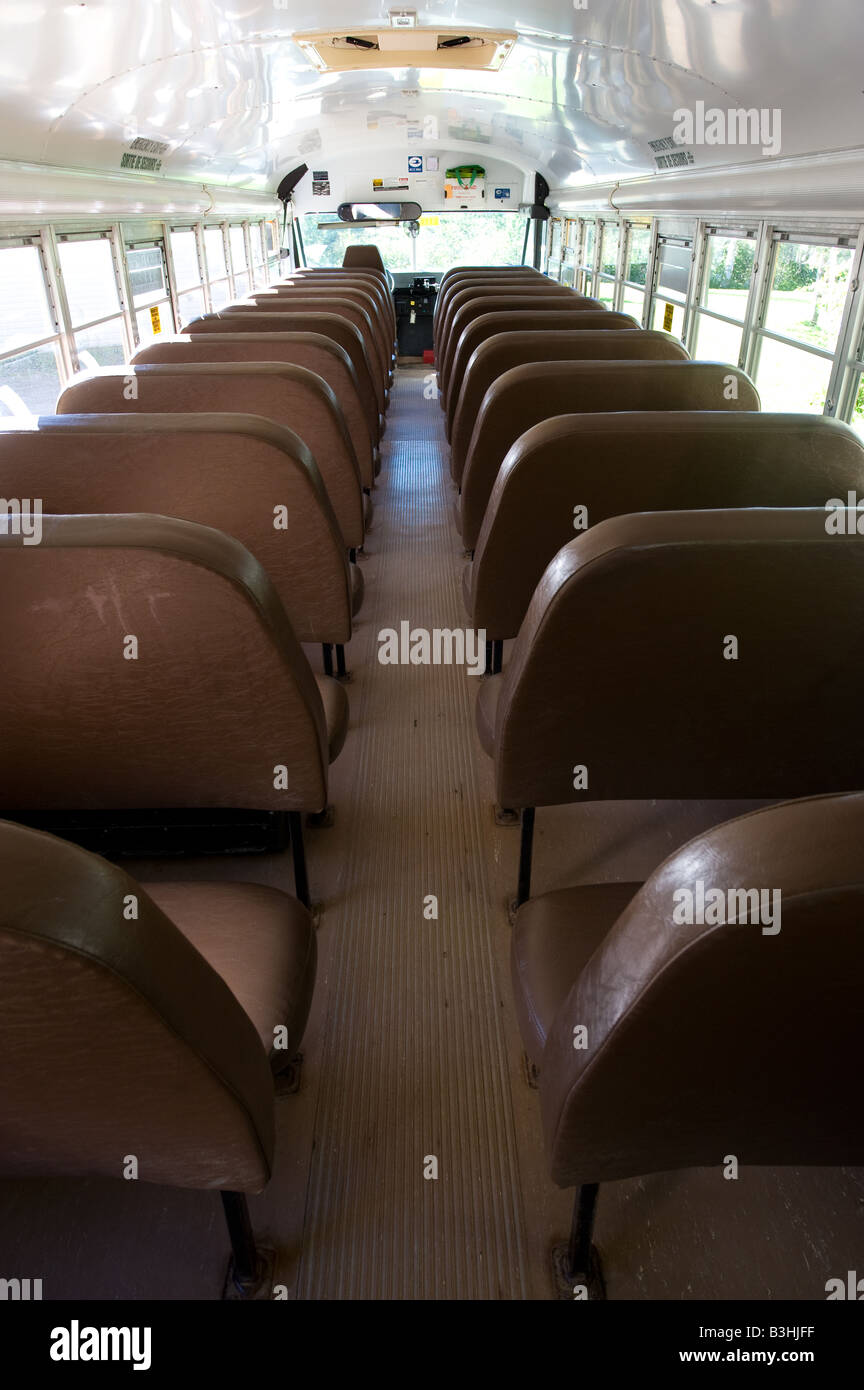 Interior Of Modern School Bus With Isle As Rows Of Seats For