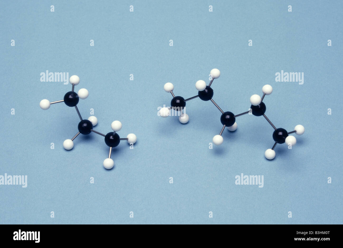 ball and stick molecular models of propane (left) pentane (right) Stock Photo