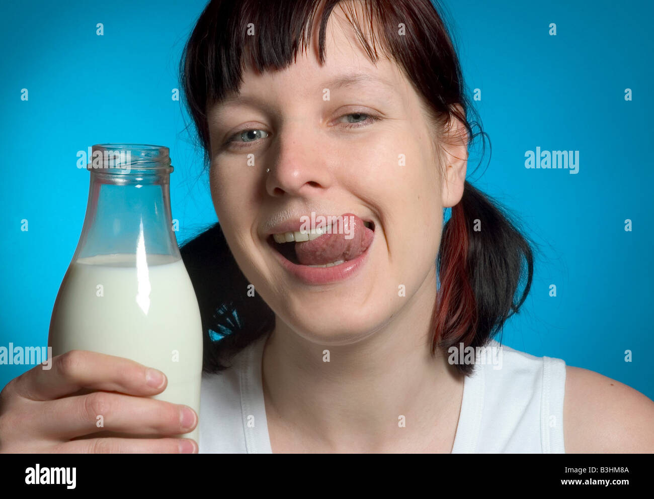 young woman with a milk bottle Stock Photo Alamy