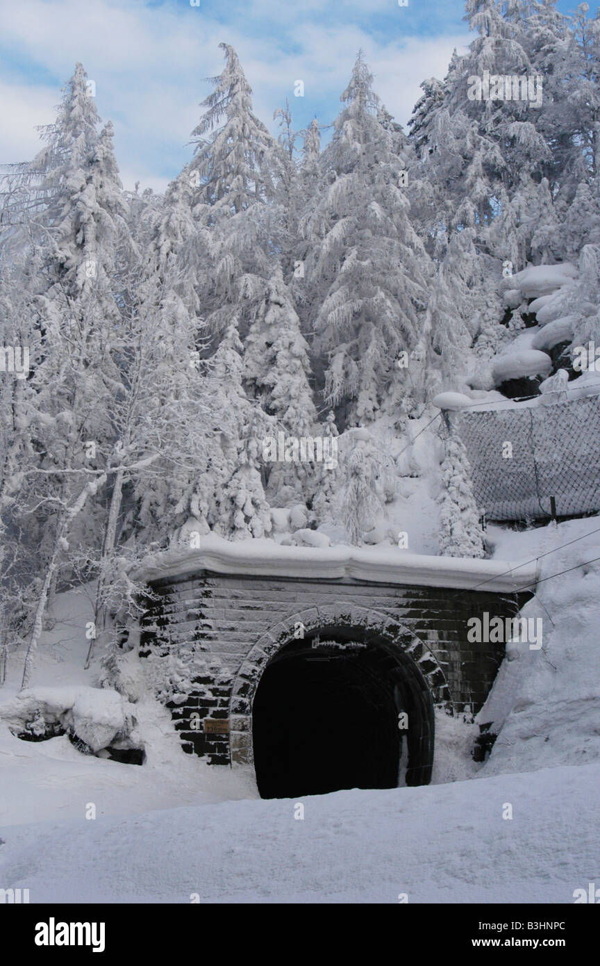 Railway tunnel in snowy winter landscape Stock Photo - Alamy