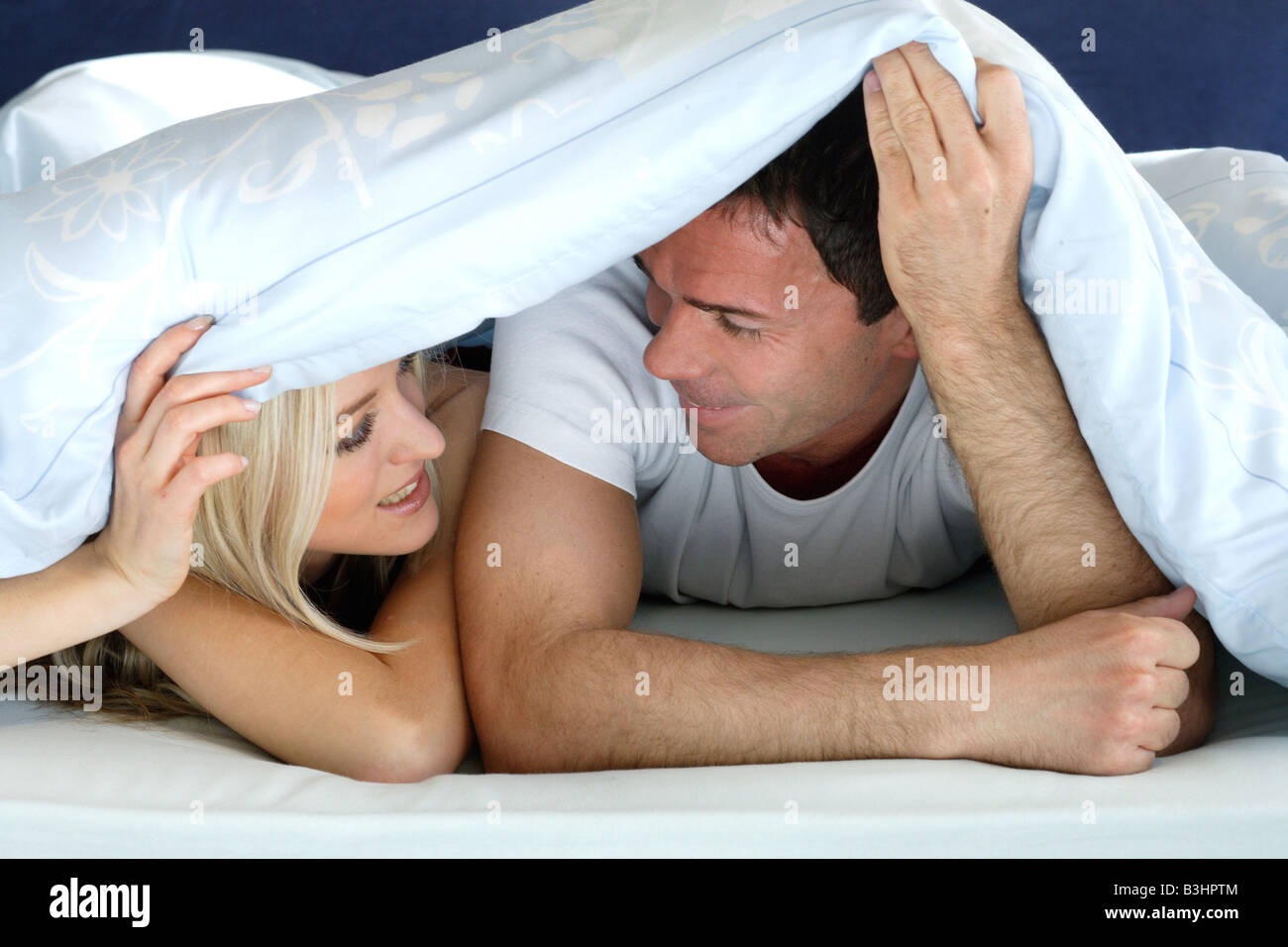 Woman snuggle blanket hi-res stock photography and images photo