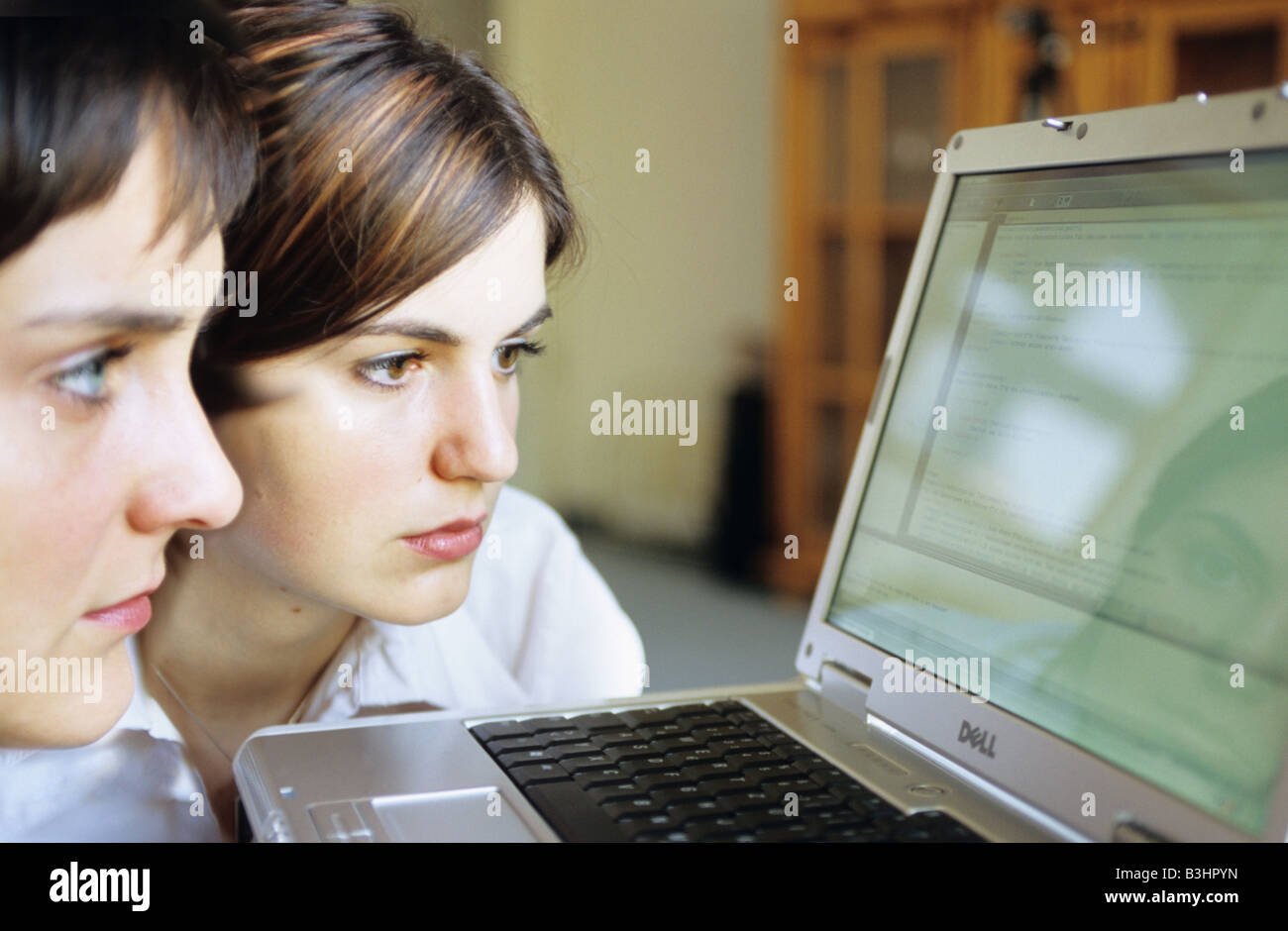 two ladies with a notebook Stock Photo