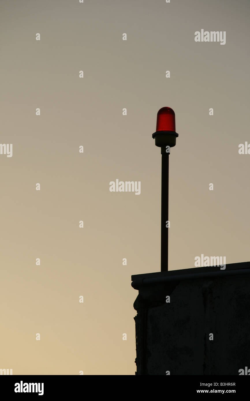 red security light on pole on property at night Stock Photo Alamy