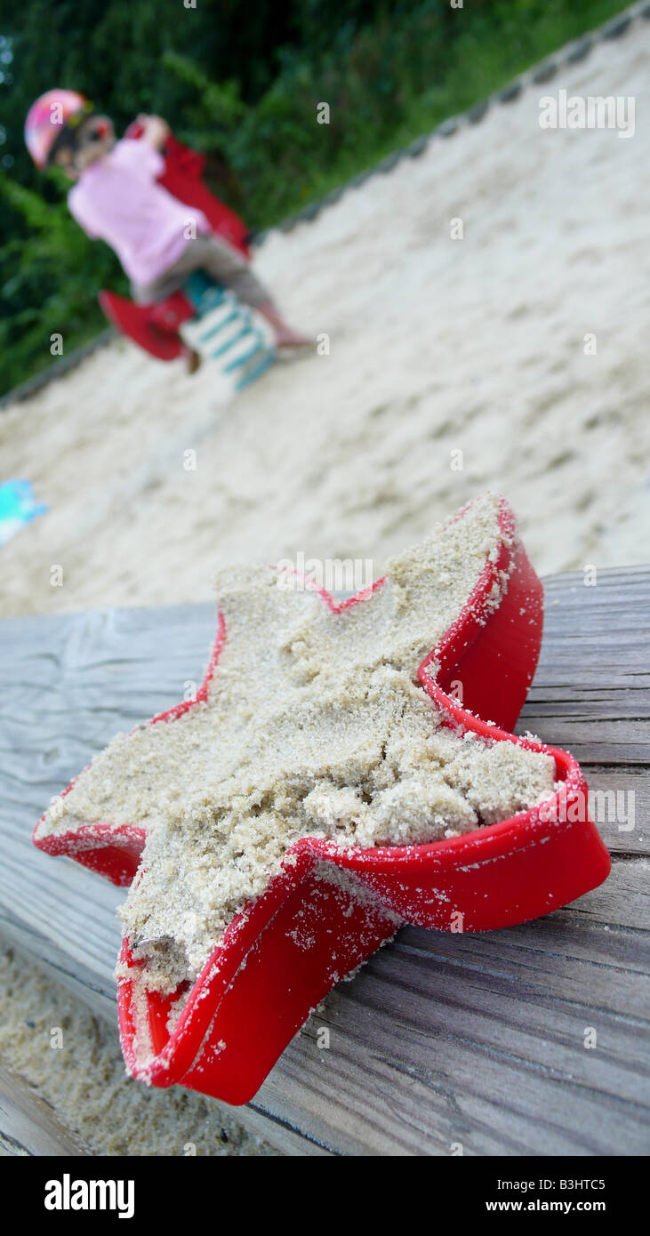 filled sand mold on a children playground Stock Photo
