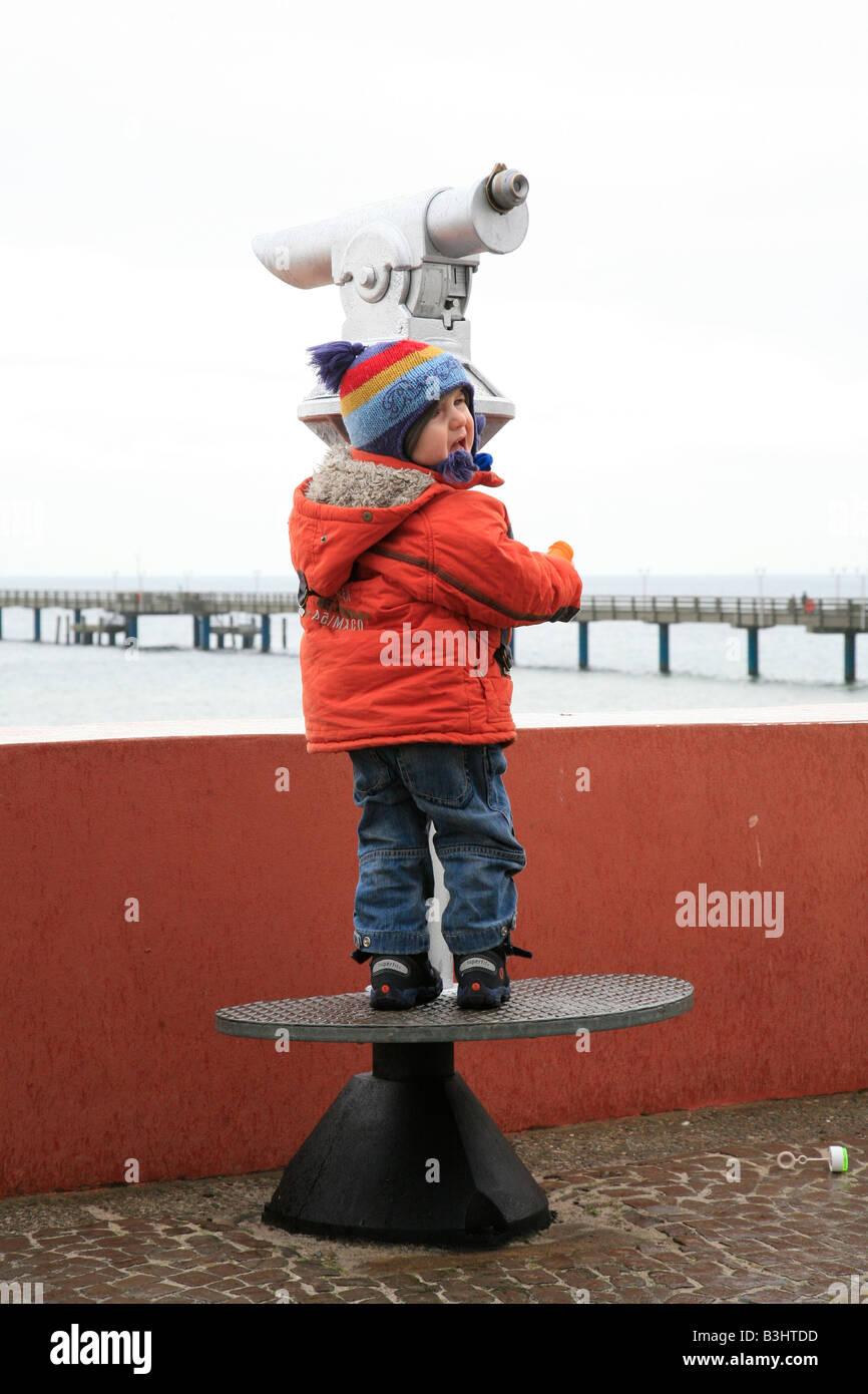 small boy at a binocular Stock Photo