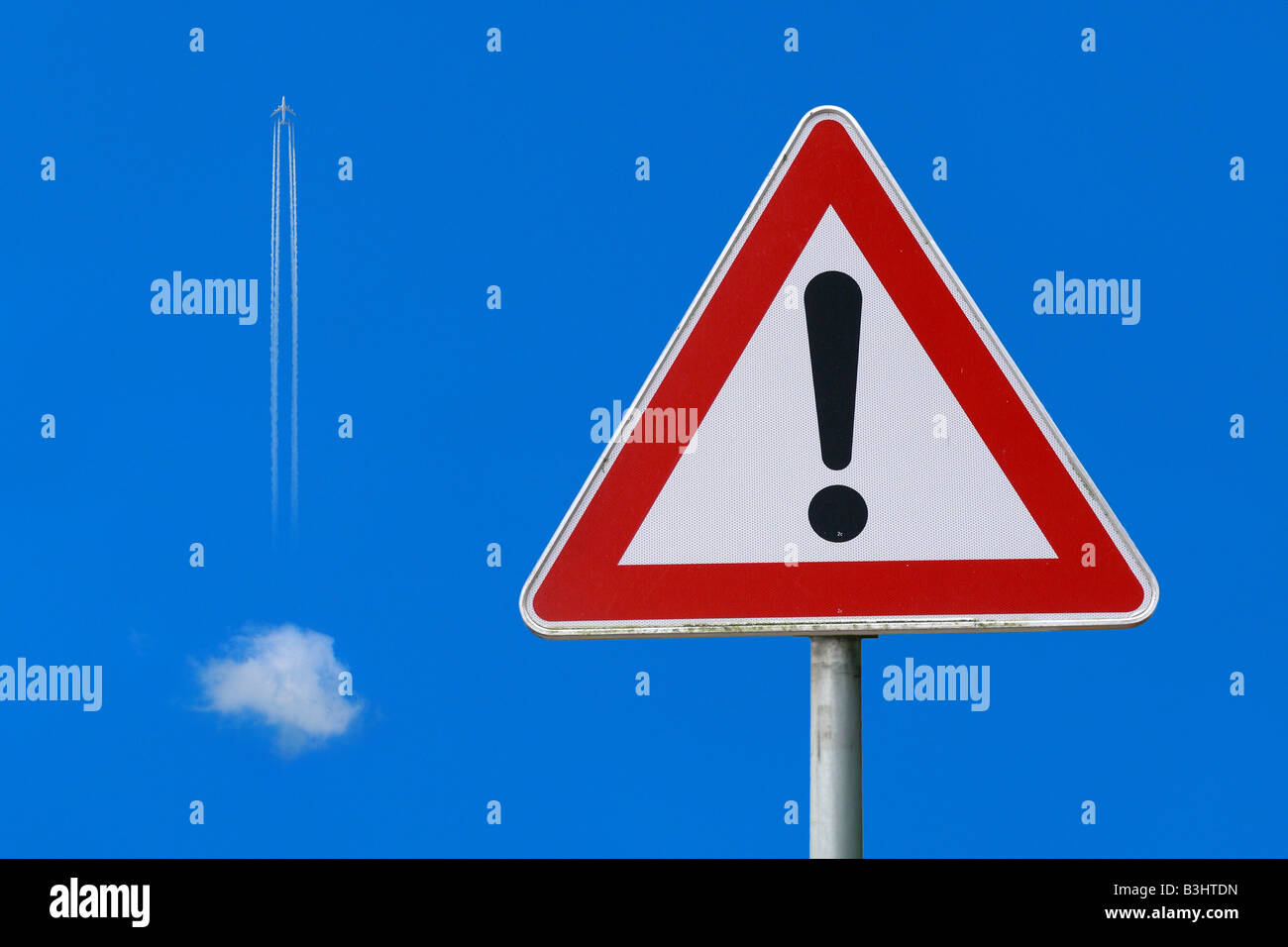 airplane obeying traffic sign, flying an exclamation mark Stock Photo