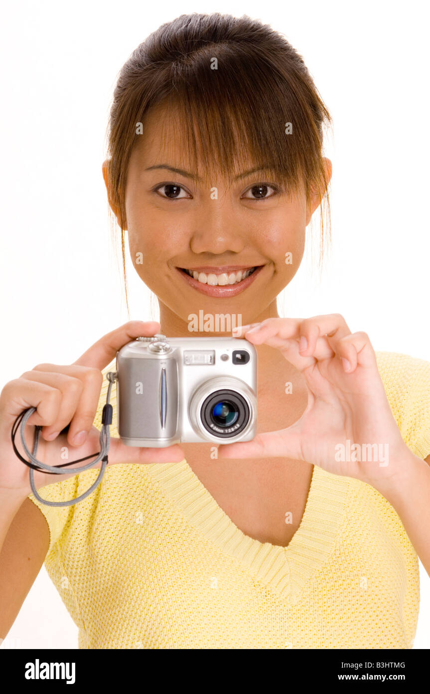 A Pretty Young Asian Girl With A Point And Shoot Digital Camera Stock A pretty young asian girl with a point and shoot digital camera stock