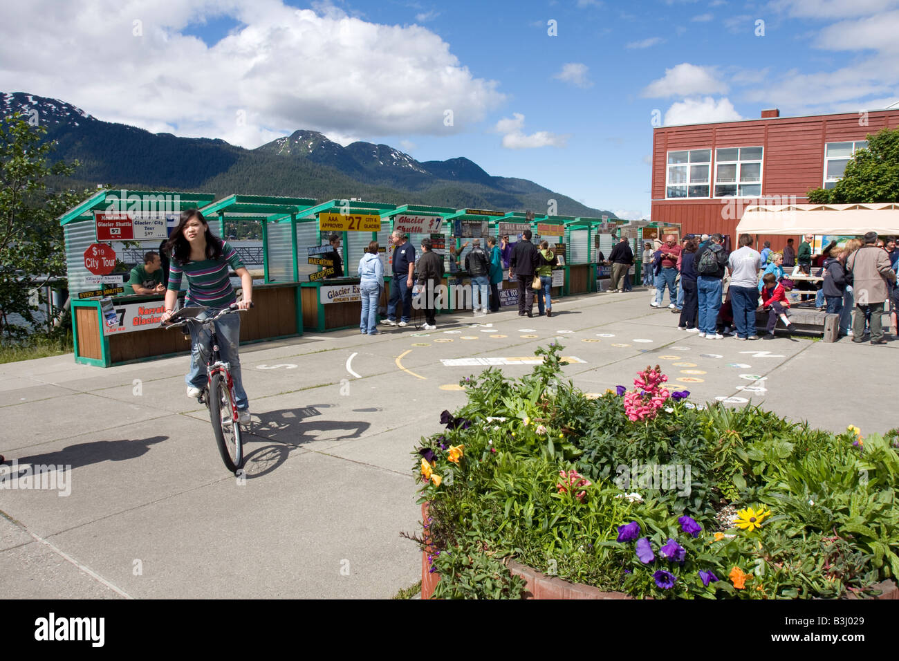 Stalls / booths where daytrips are sold to tourist on the square near Mt Roberts Tram, Juneau, Alaska Stock Photo